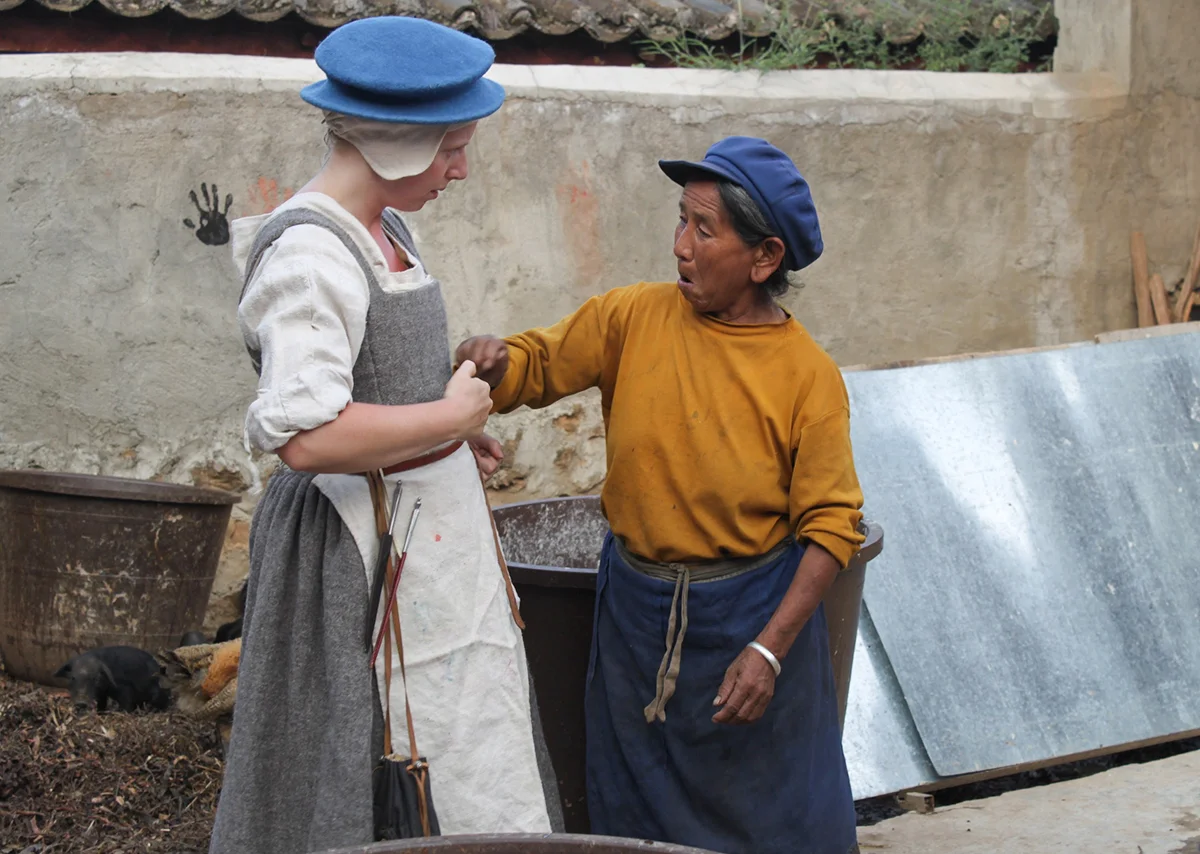 1. Wei Jie Lan examines Sigrid's clothes - thumbnail.jpg