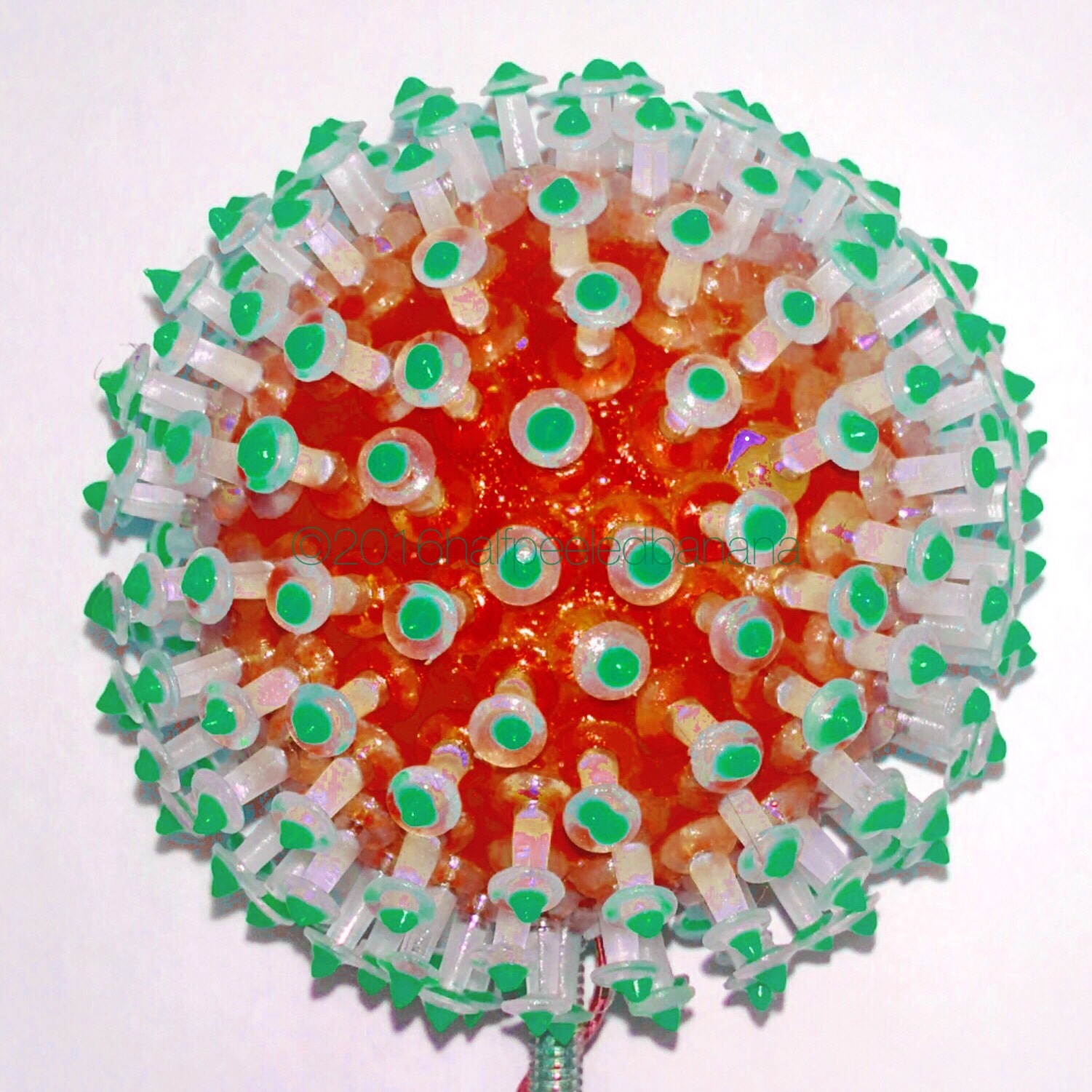 orange flower 4" pins style with green dots on a metal & wire 24" stem