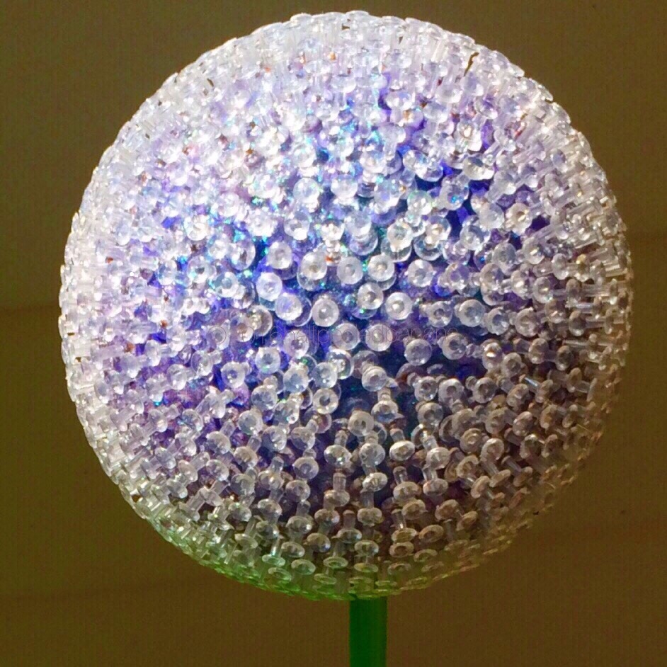 purple flower like an allium. 7" diameter on a 36" wood stem