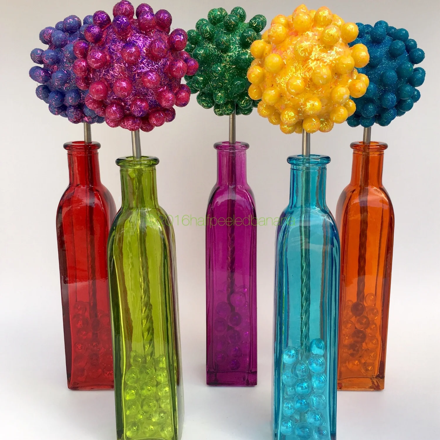 perfect tabletop flowers in purple, bright pink, dark green, yellow and dark blue!
