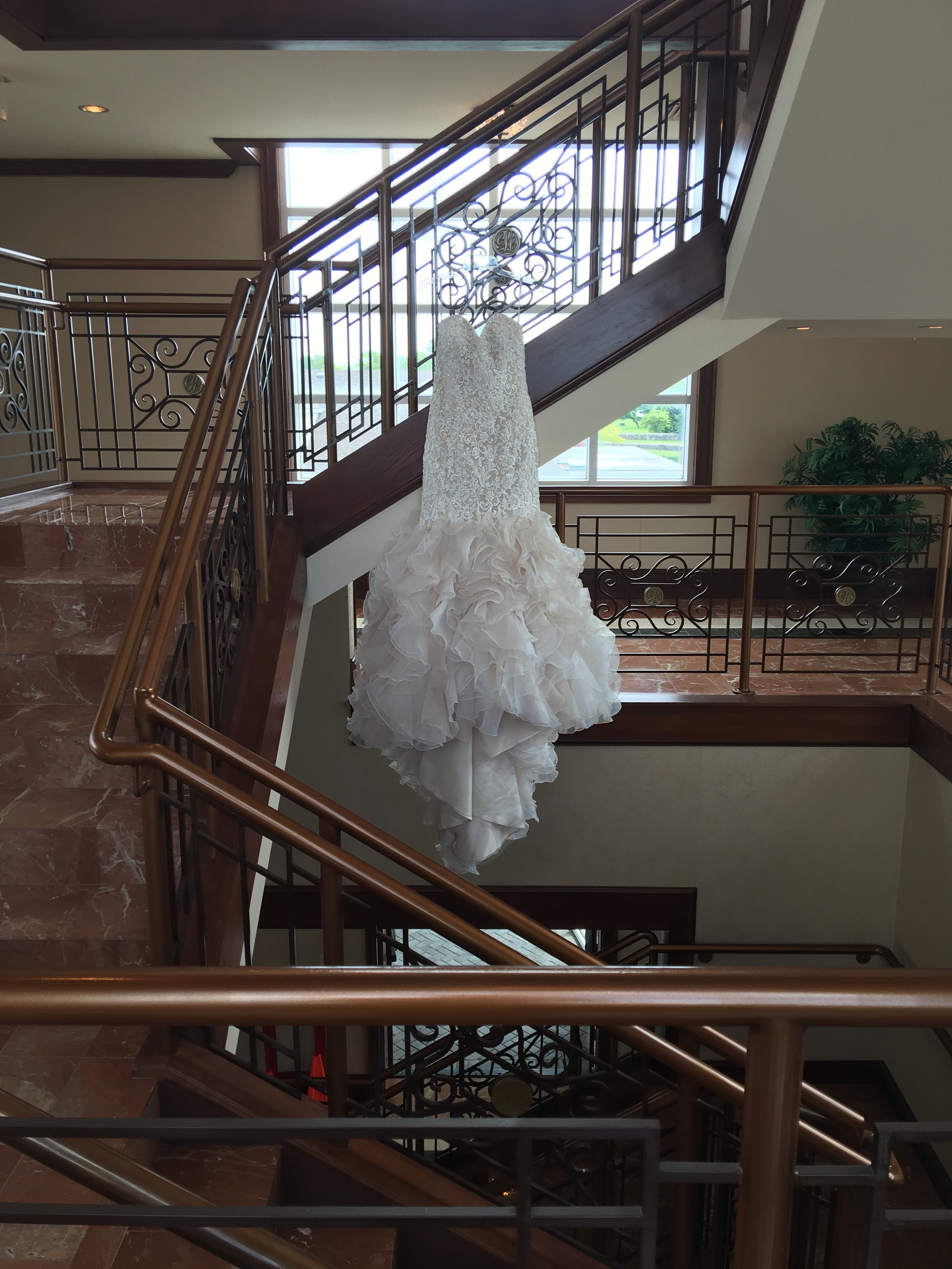 I love this shot, it screams exclusivity. The railings look as if they are guarding the dress.