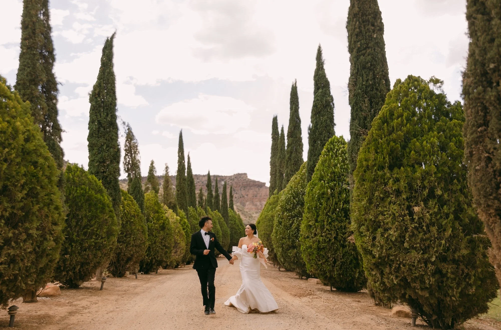 bride and groom running whimsy