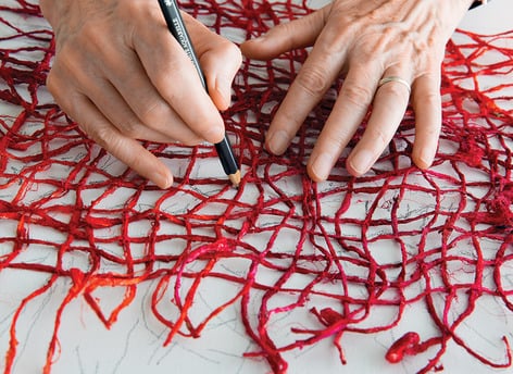 Iwata traces the shadow of a kibiso tapestry onto canvas. Her artmaking is fluid and free. “I’m totally open,” she says. “And because I’m open, I can float. For me, that’s an exciting process in itself.” Photo: Robert Severi - See more here. 