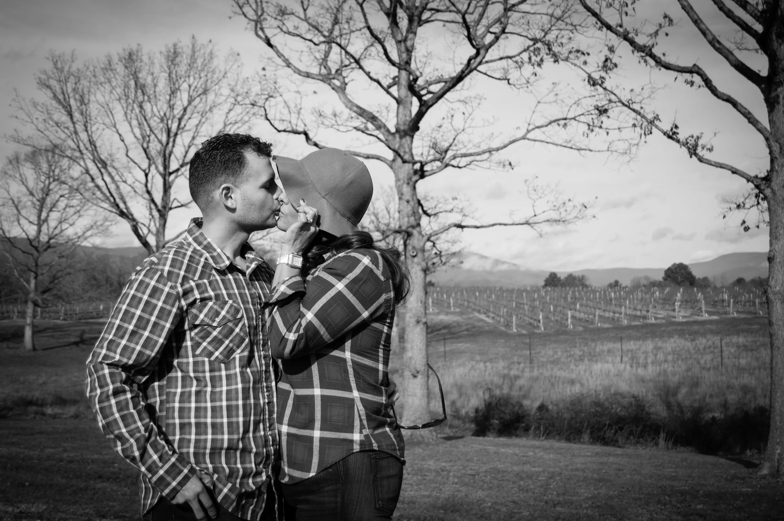 Stealing a kiss in the warm winter sun, with Grace Estate Vineyard looking lovely in the background.