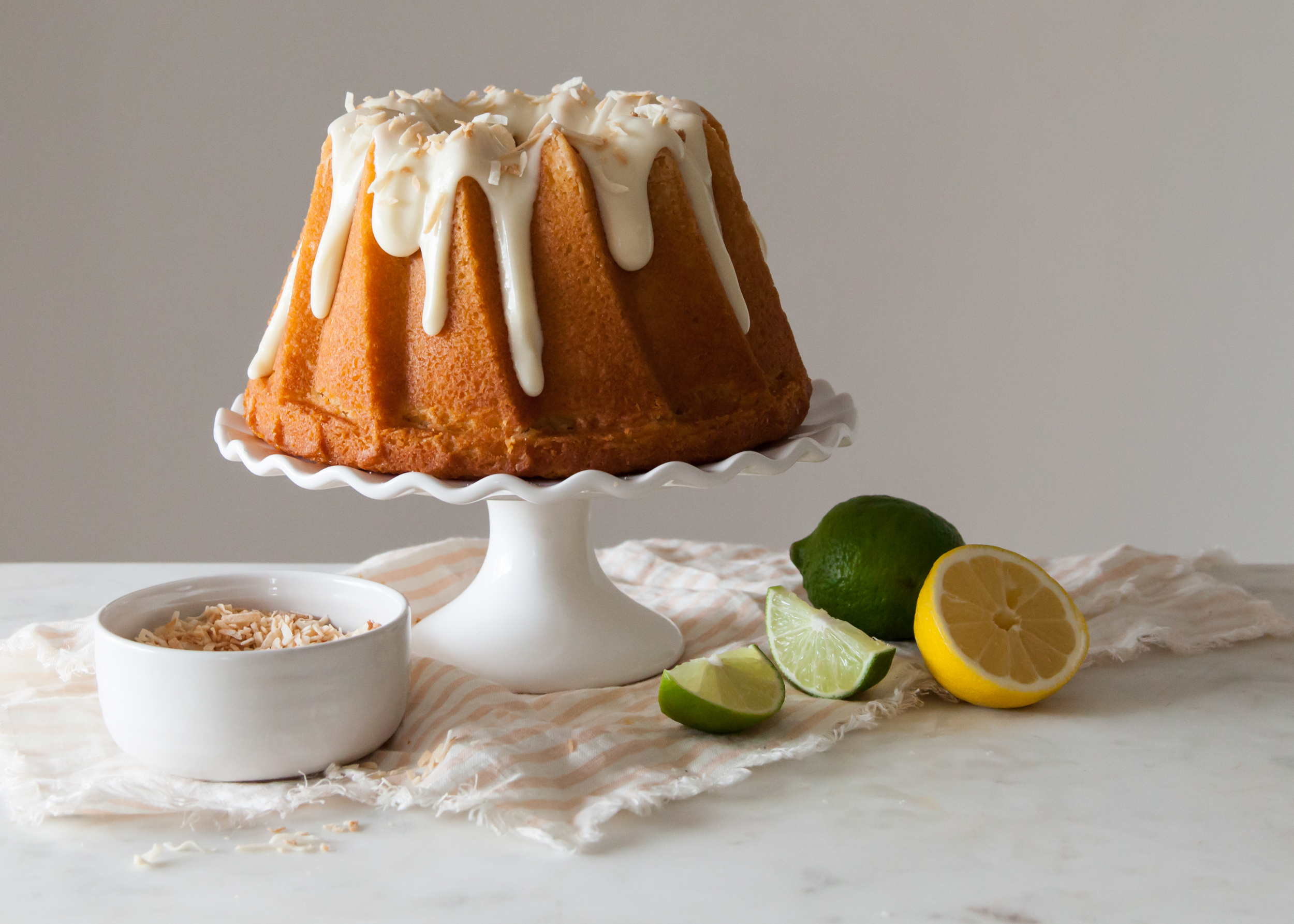 Citrus Bundt Cake with cream cheese glaze and toasted coconut.