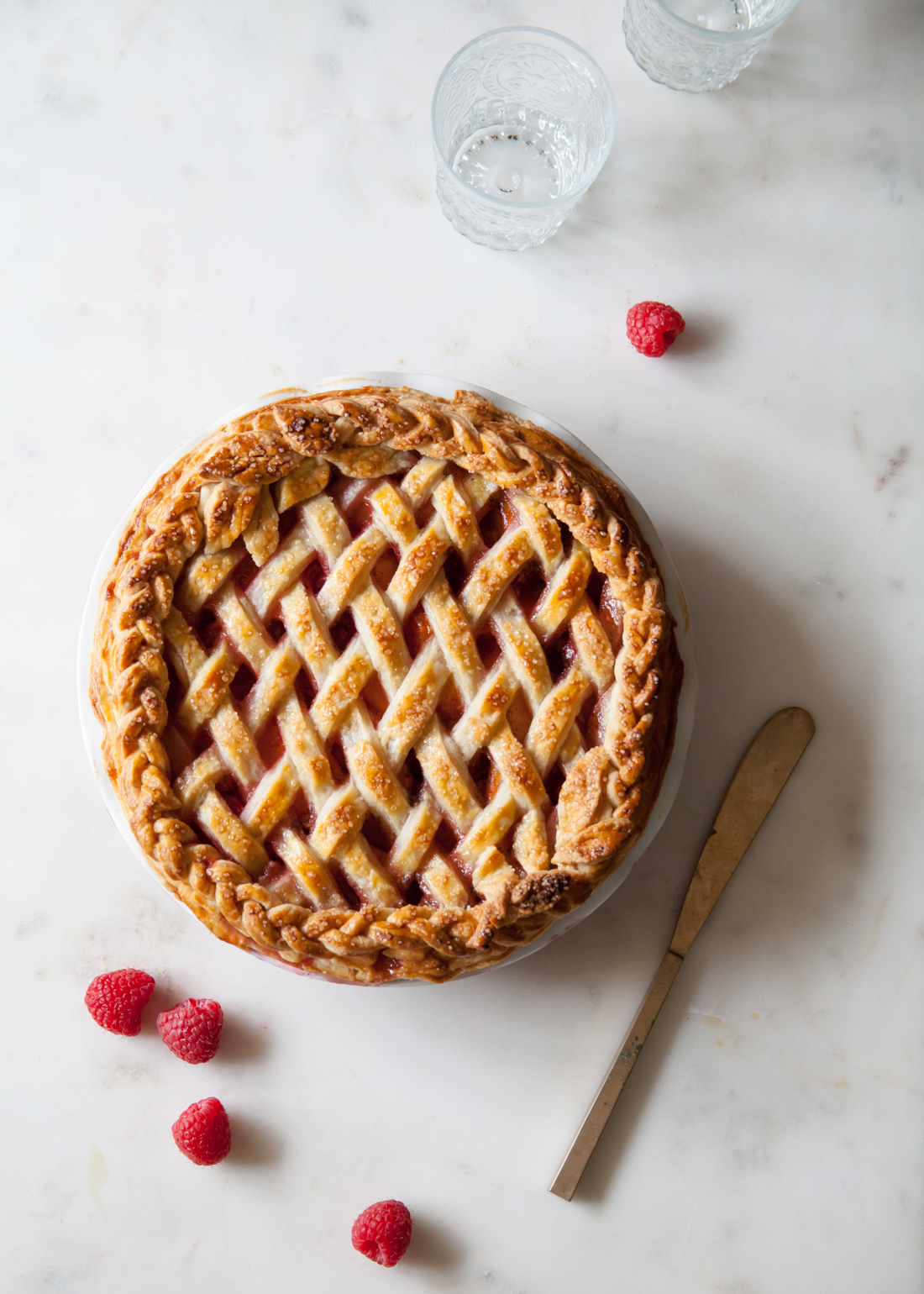 Apricot Raspberry Pie with an all butter crust and braided, lattice design.