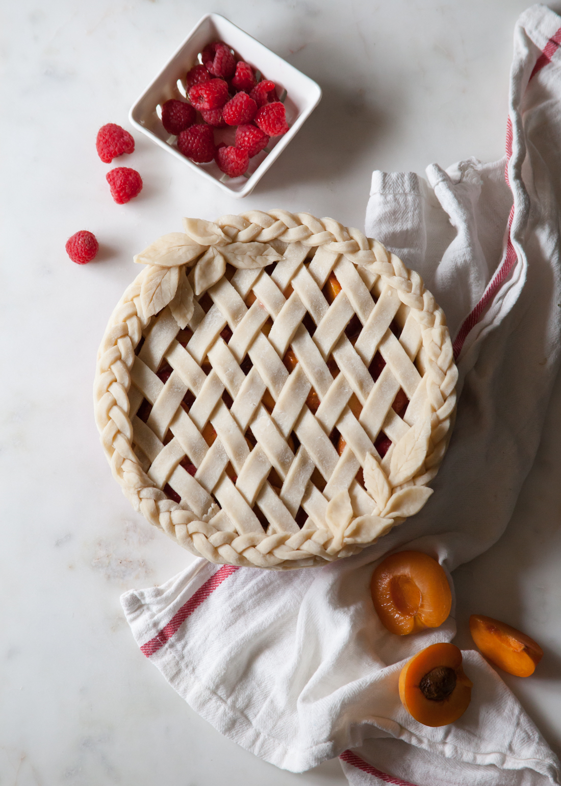 Apricot Raspberry Pie with an all butter crust and braided, lattice design.