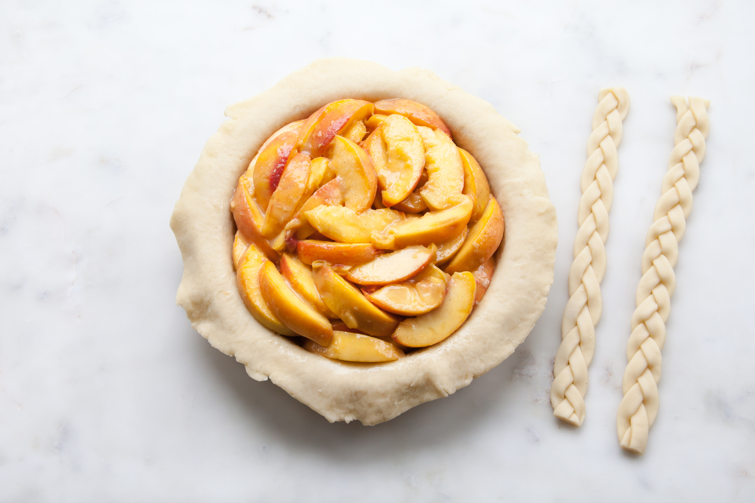 Cinnamon Peach Pie with an all-butter braid pie crust.