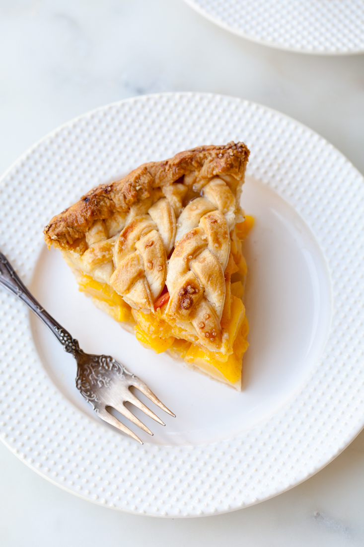 Cinnamon Peach Pie with an all-butter braid pie crust.