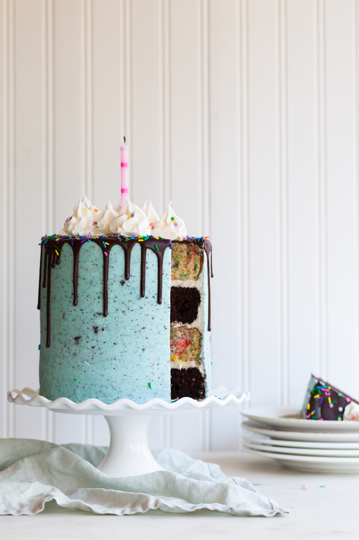 Birthday Oreo Cake with confetti cake, chocolate cake, and oreo frosting.