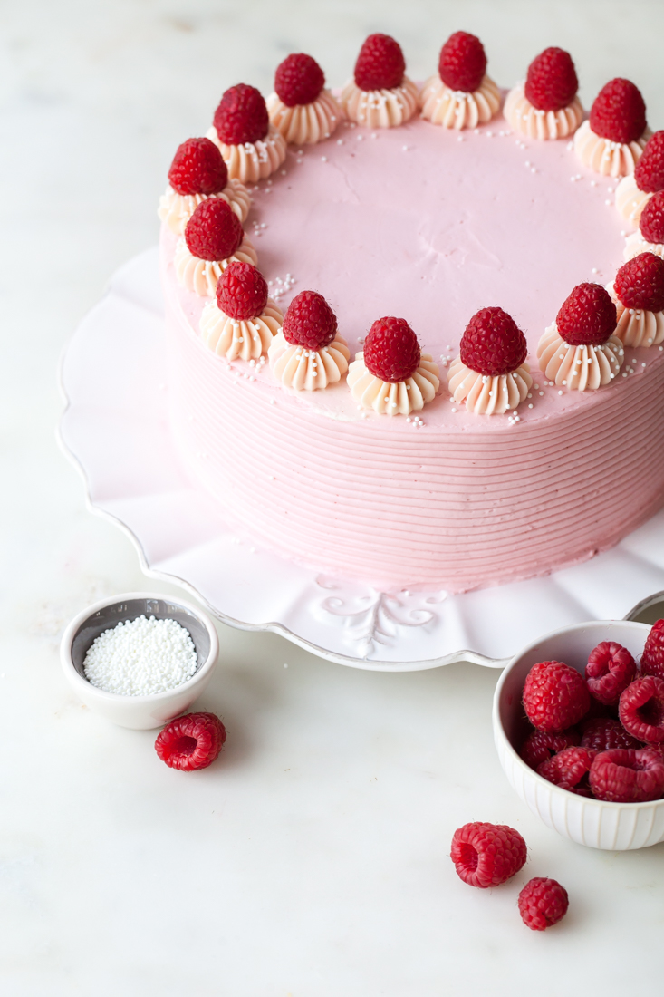 Chocolate Raspberry Layer Cake with jam and raspberry cheesecake buttercream.  Perfect for Valentine's Day!