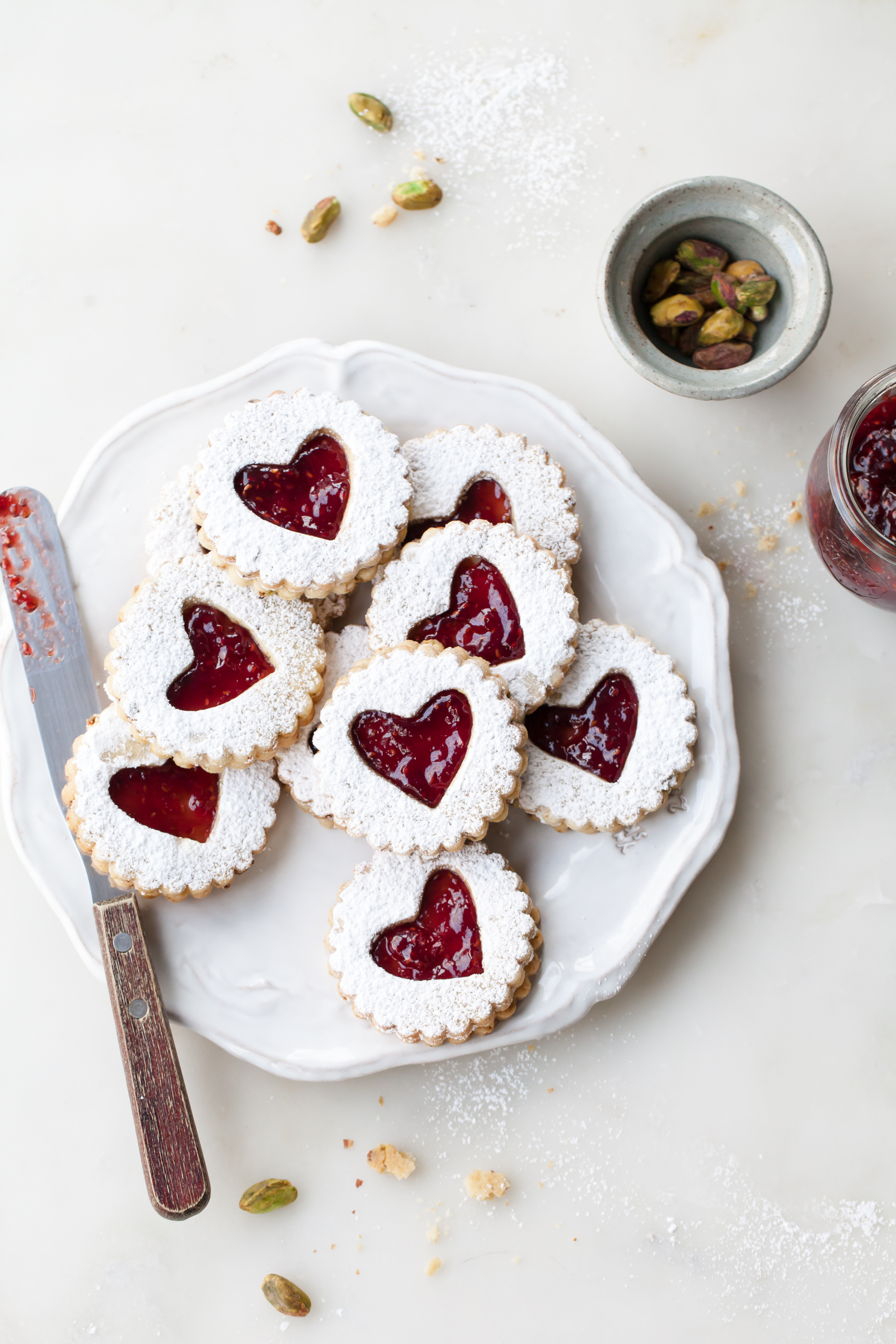 Pistachio Linzer Cookies with raspberry jam filling