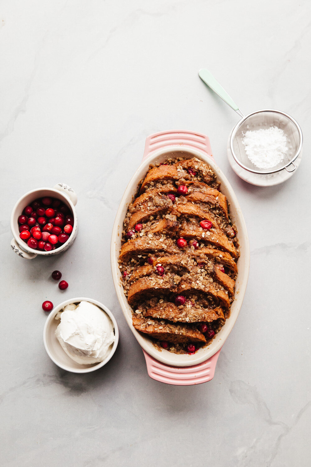 Overnight Gingerbread French Toast Recipe with cranberries, streusel, and whipped cream