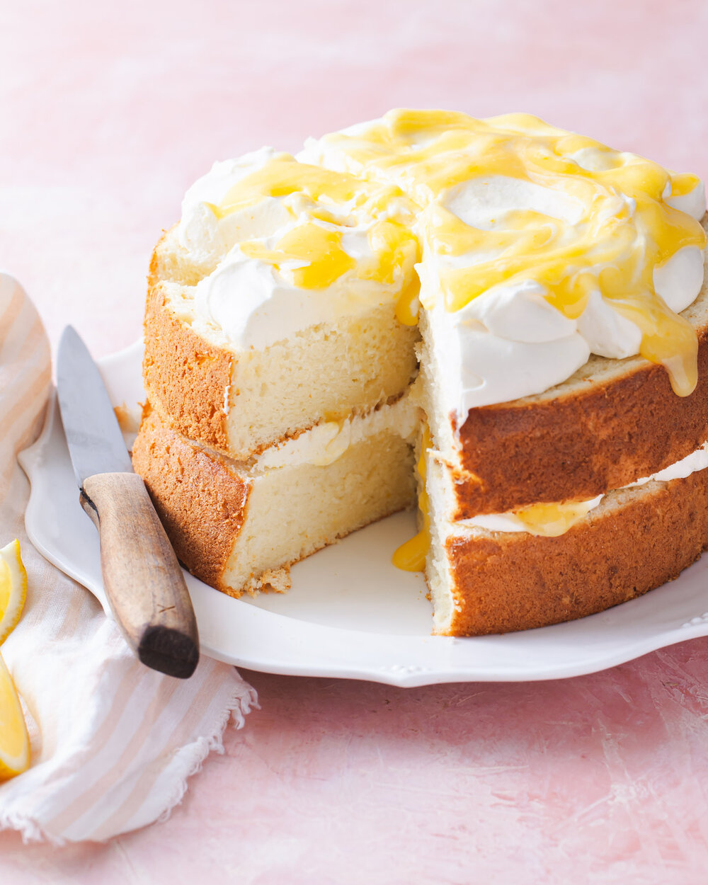 Layers of Lemon Chiffon Cake with mascarpone cream and lemon curd swirls.