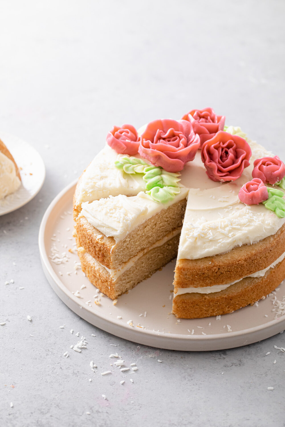 Almond Layer Cake with cream cheese frosting and buttercream flowers