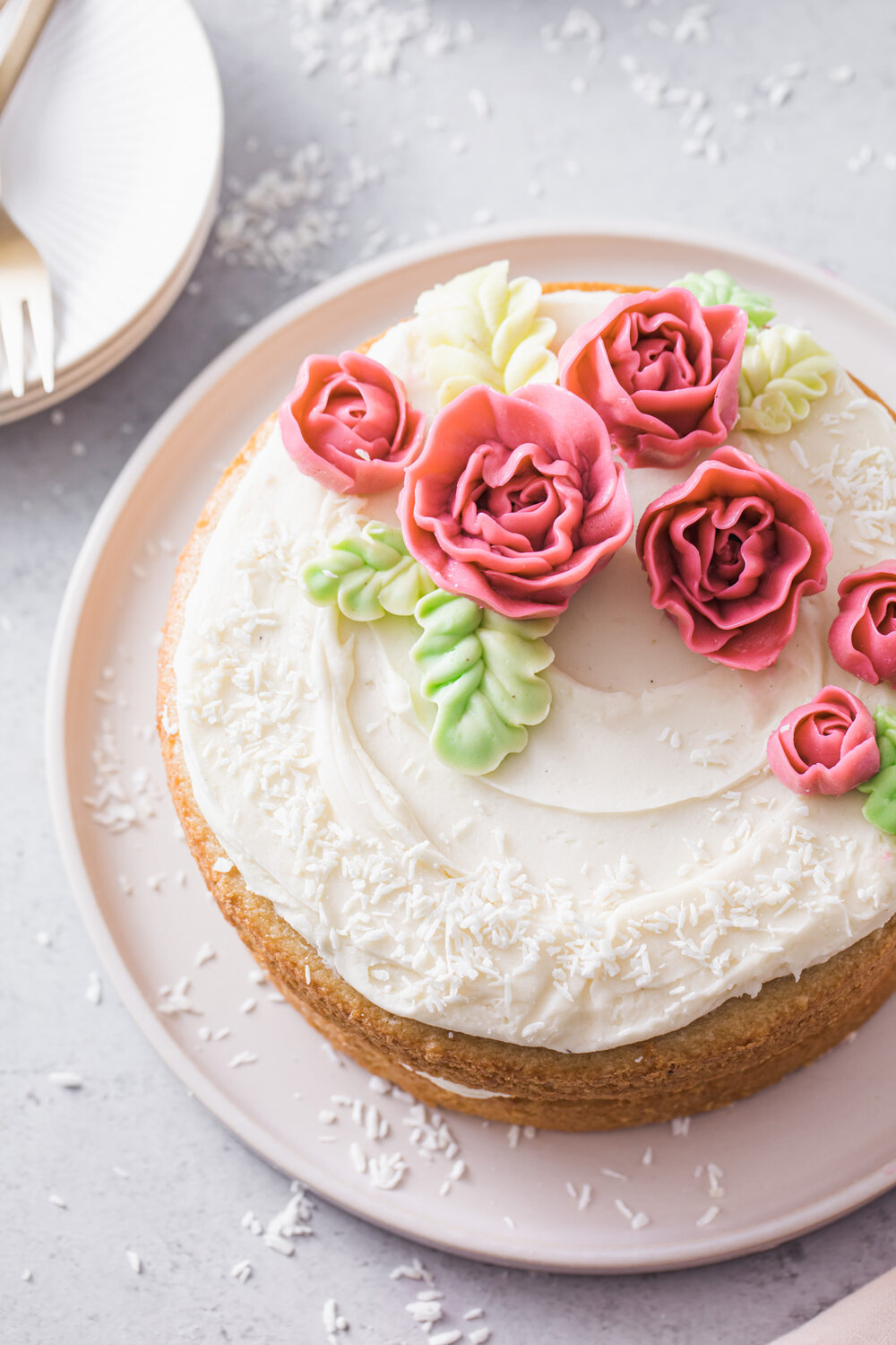 Almond Layer Cake with cream cheese frosting and buttercream flowers