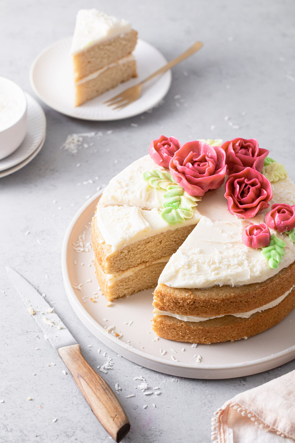 Almond layer cake with swirls of cream cheese frosting.  The perfect two-layer "naked" cake for spring!