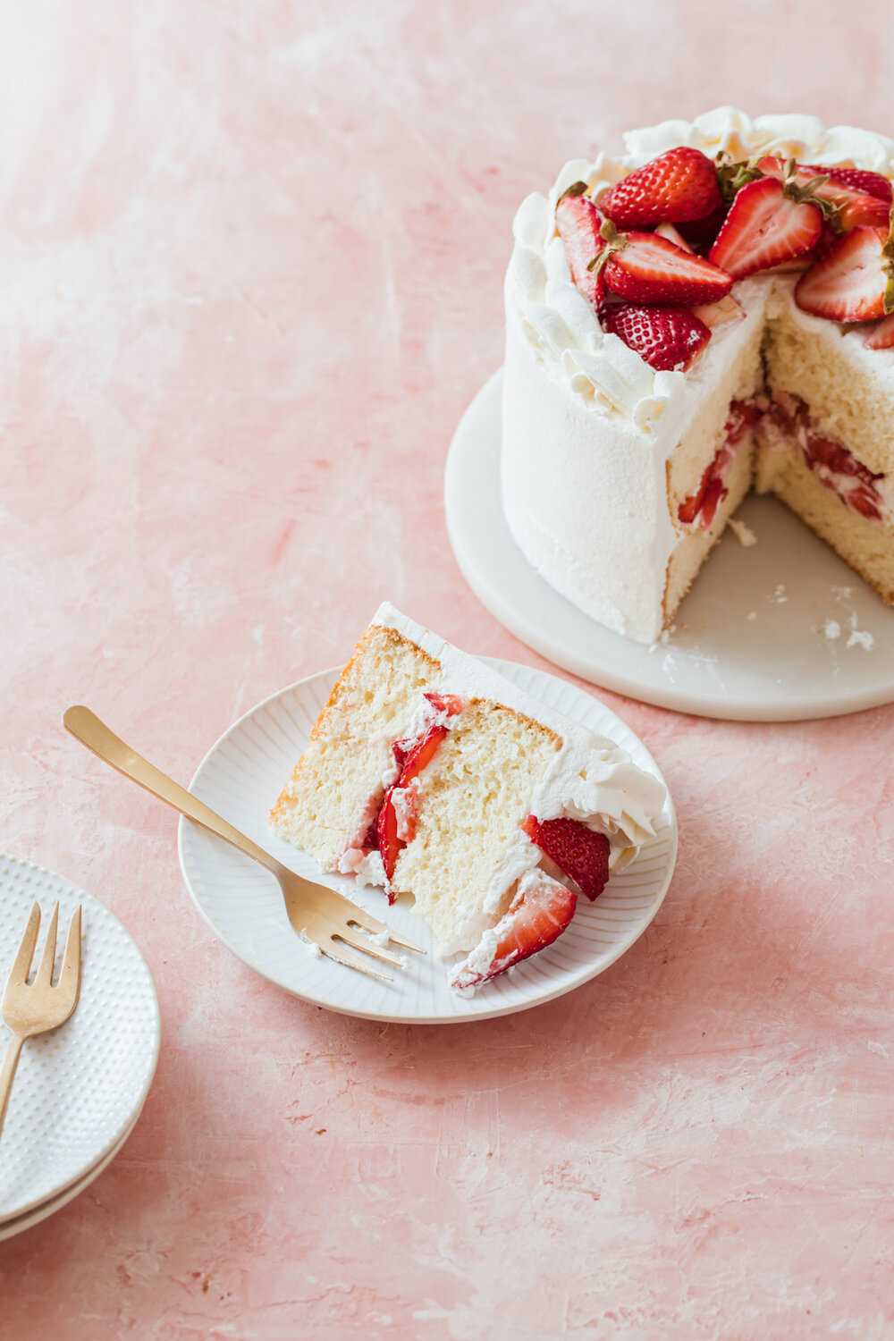 Small strawberry chiffon cake with whipped cream frosting