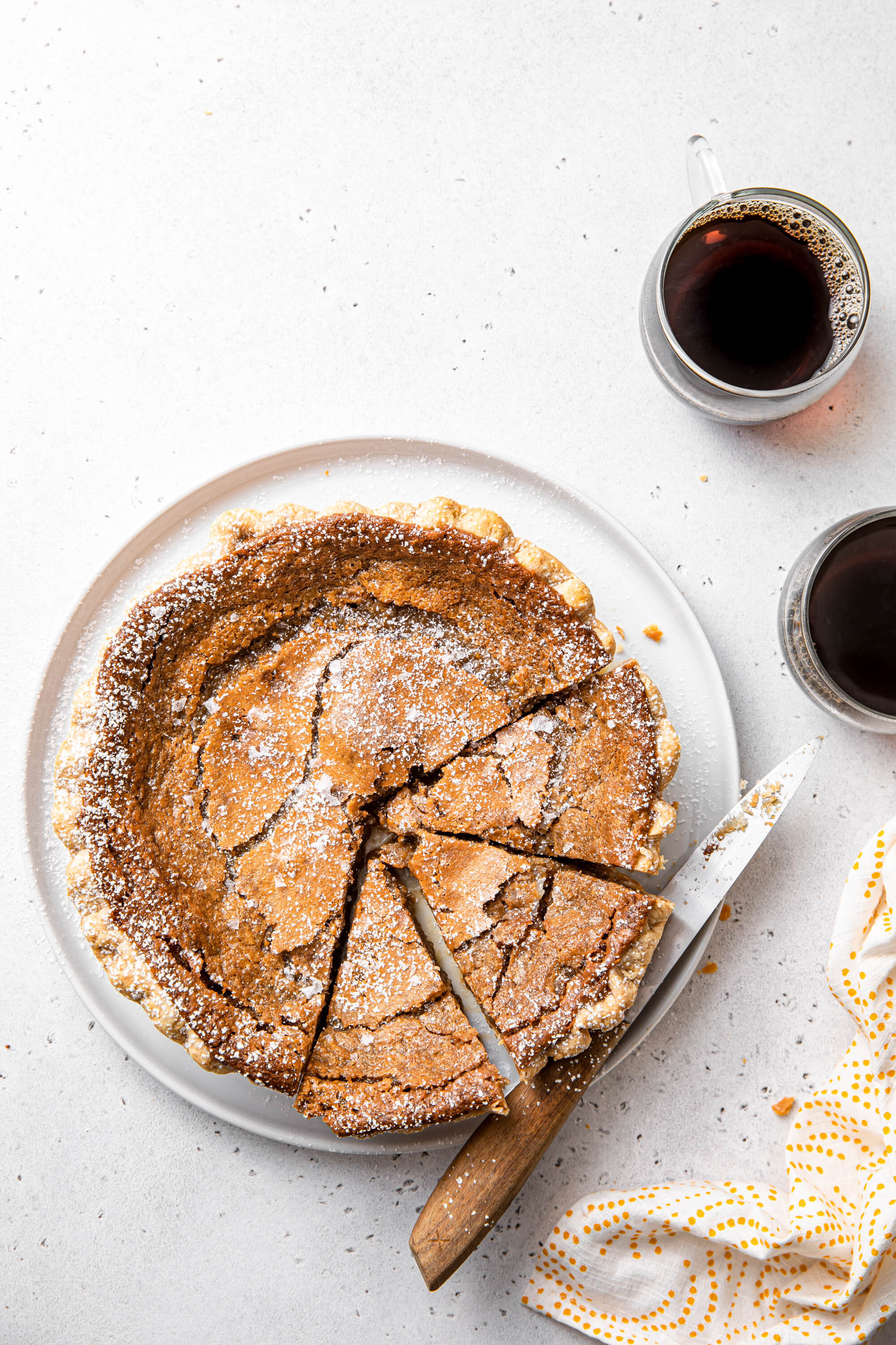 A French Canadian Maple Sugar Pie with powdered sugar on top.