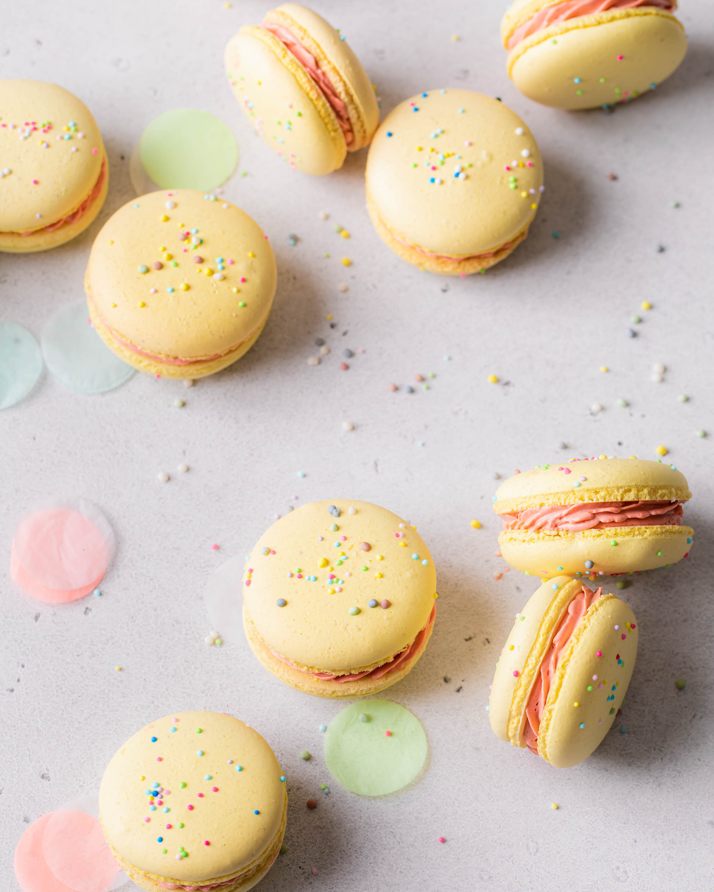 Confetti French macarons with sprinkles on top.
