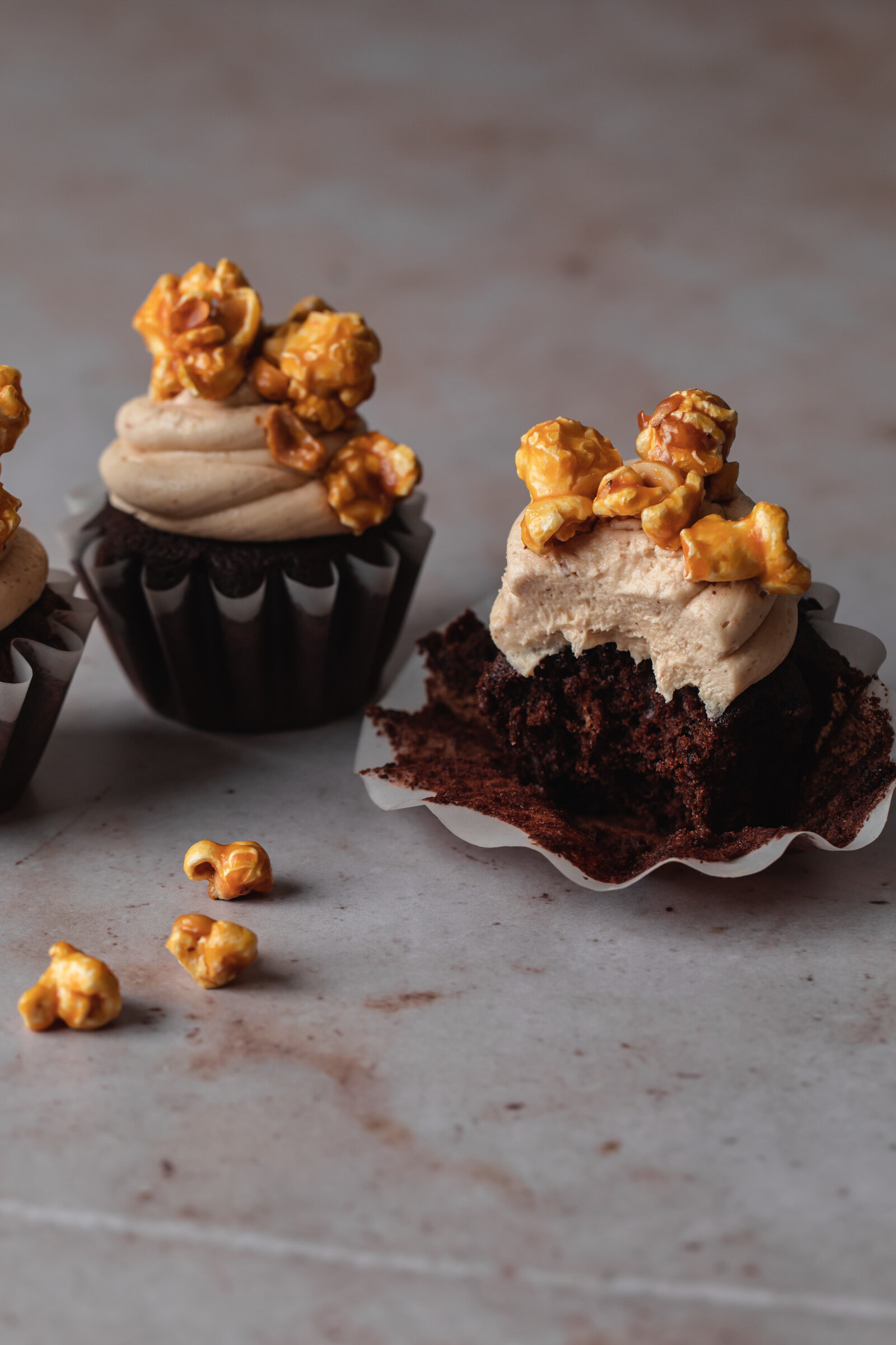 Devil's Food Cupcakes with peanut butter frosting and caramel corn topping