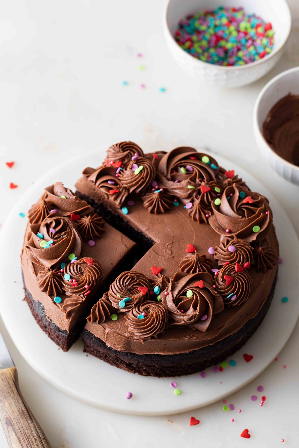 A single layer 6-inch chocolate cake with fluffy fudge frosting and sprinkle that serves just two people.