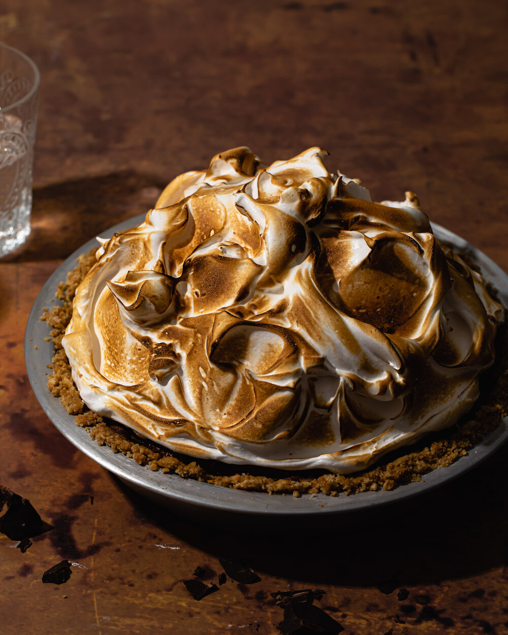 Peanut butter s’mores pie with chocolate peanut butter mousse filling and toasted meringue on top.