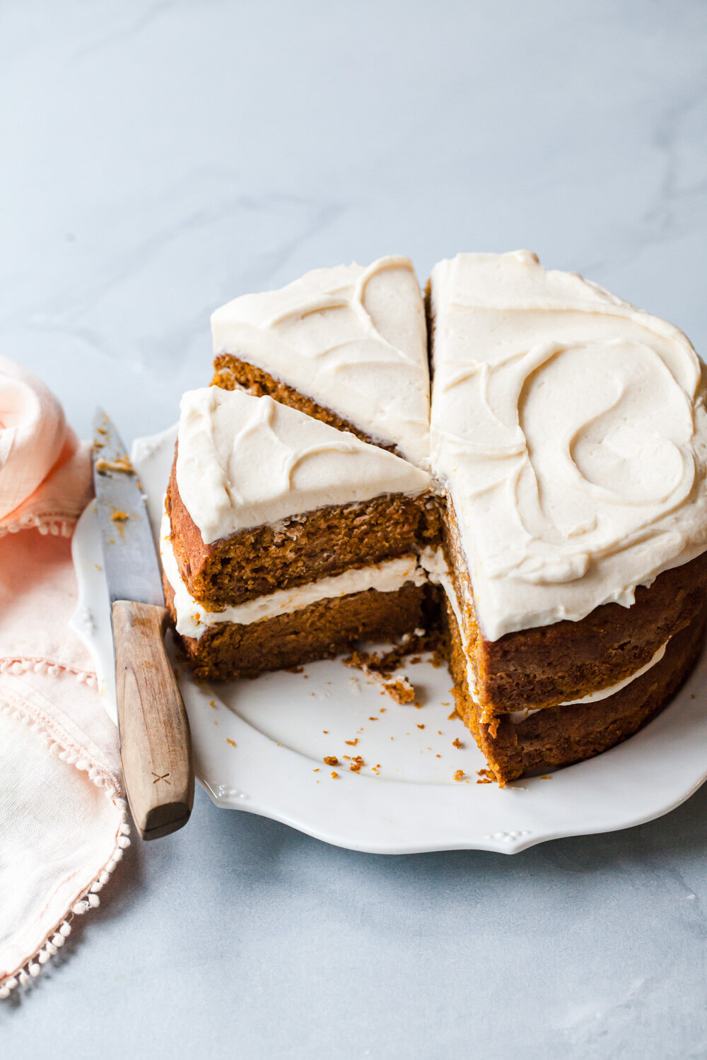 A two-layer pumpkin cake with fluffy maple cream cheese frosting.