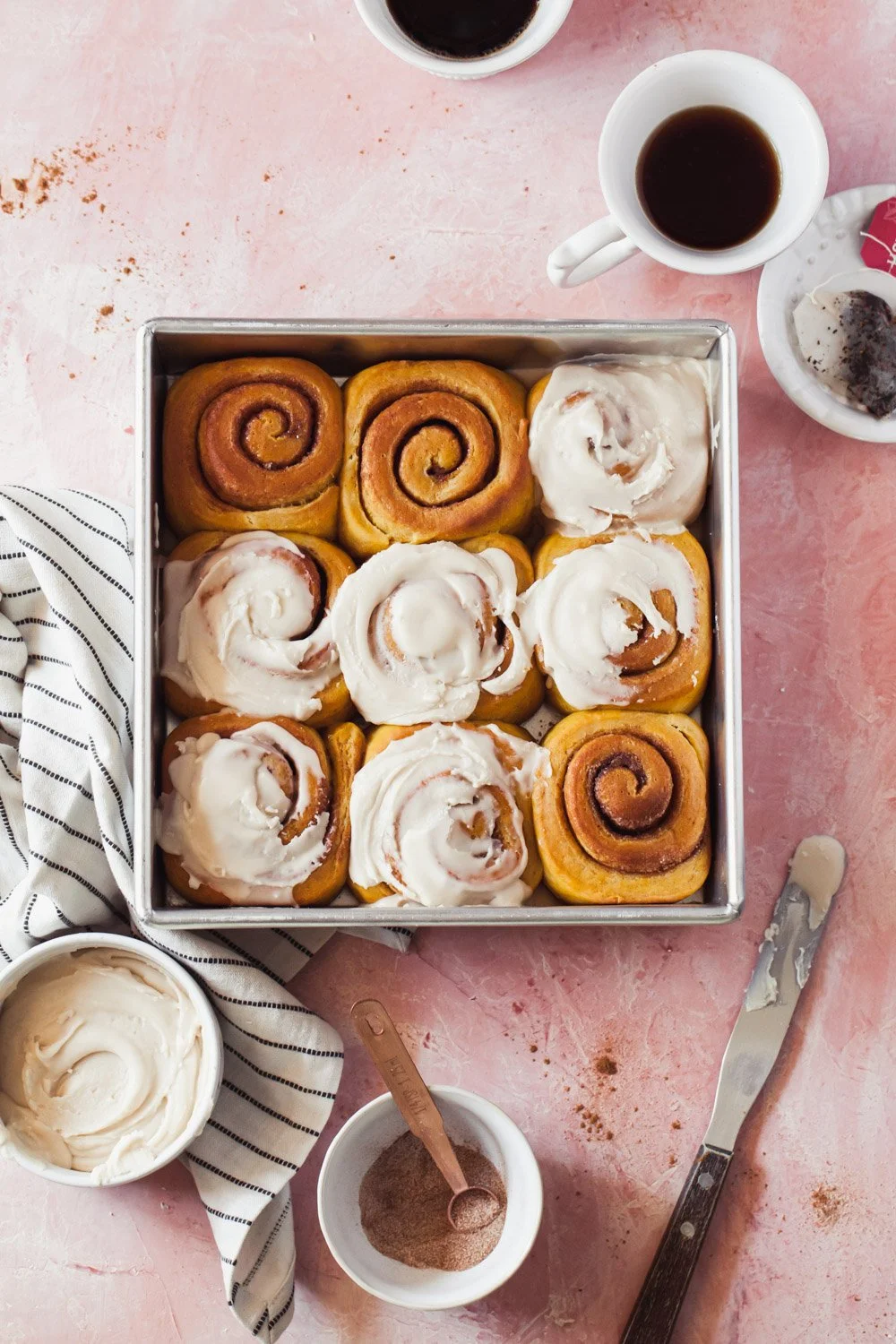 Baked Pumpkin Cinnamon Rolls with chai vanilla glaze on top