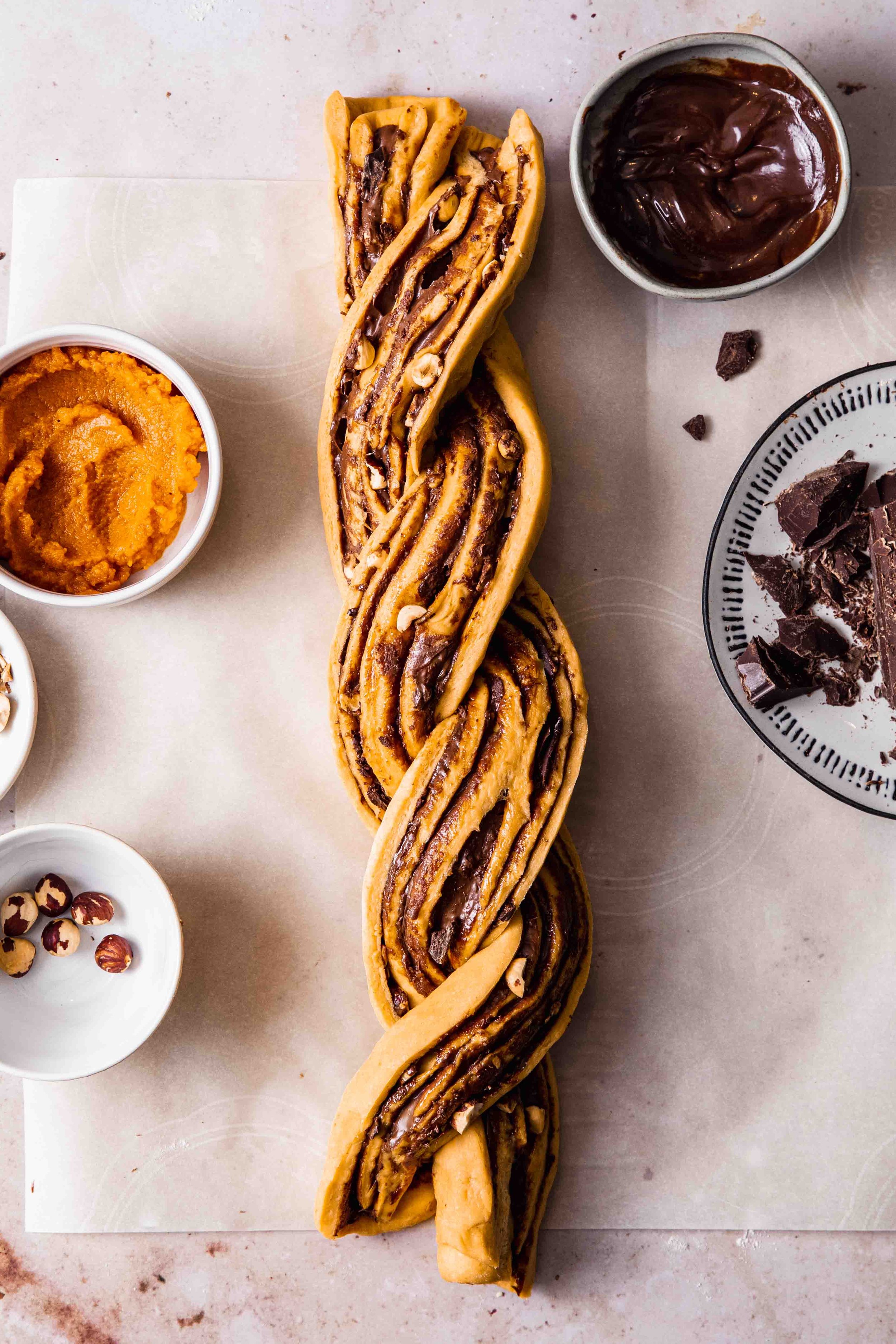 Pumpkin bake dough that is filled with chocolate spread and twisted into a braid