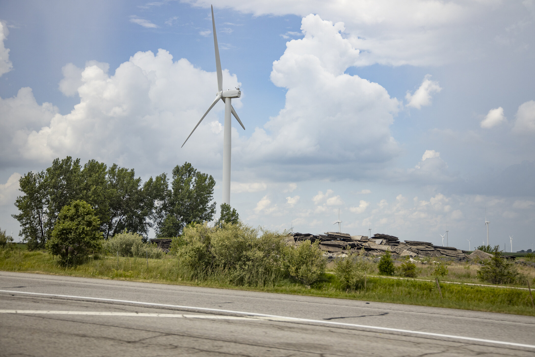 Pile of Wood by Wind Turbine  (Copy)