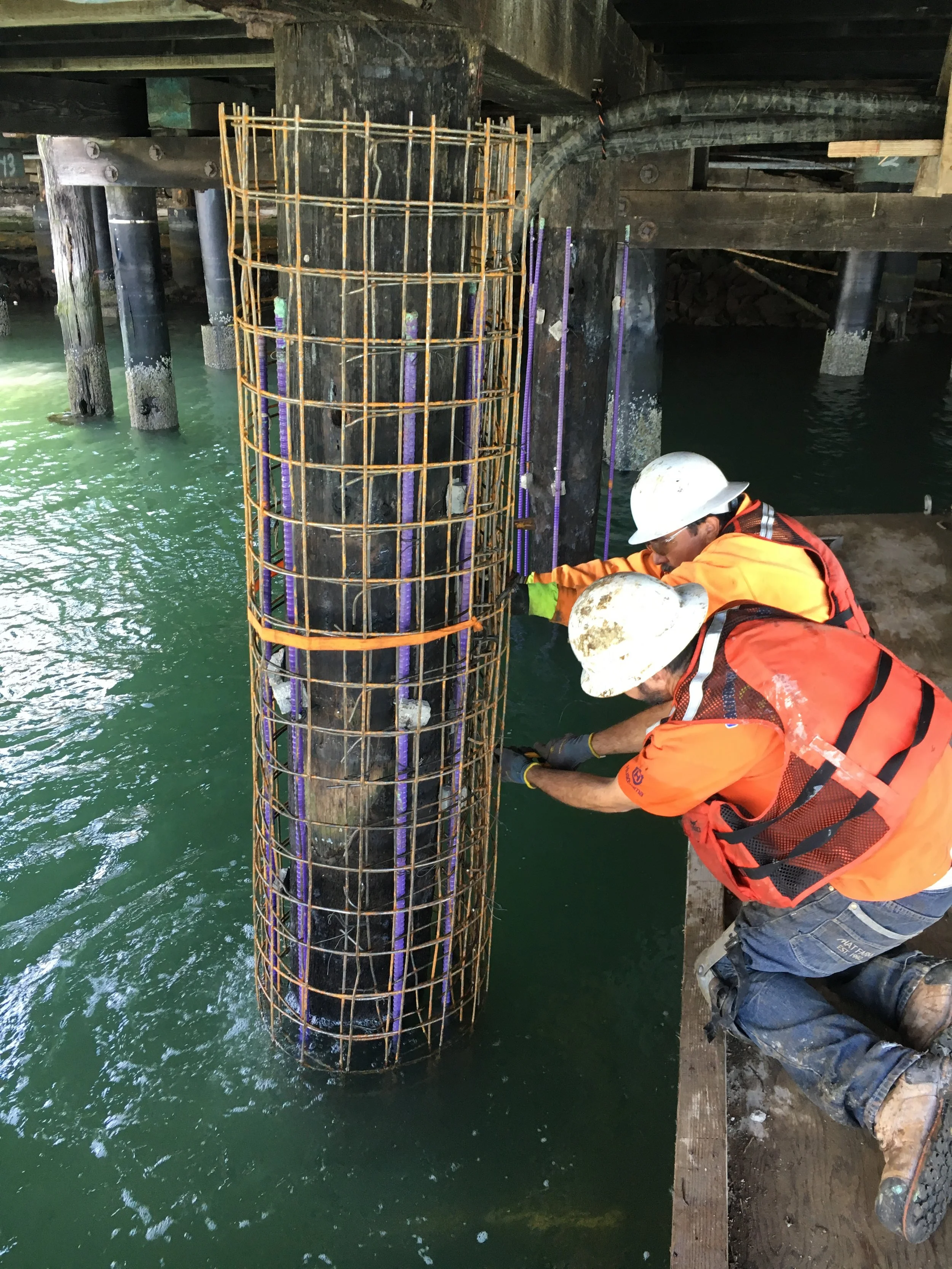 Fiber Reinforced Polymer FRP Underwater pier repair pile jacked.JPG