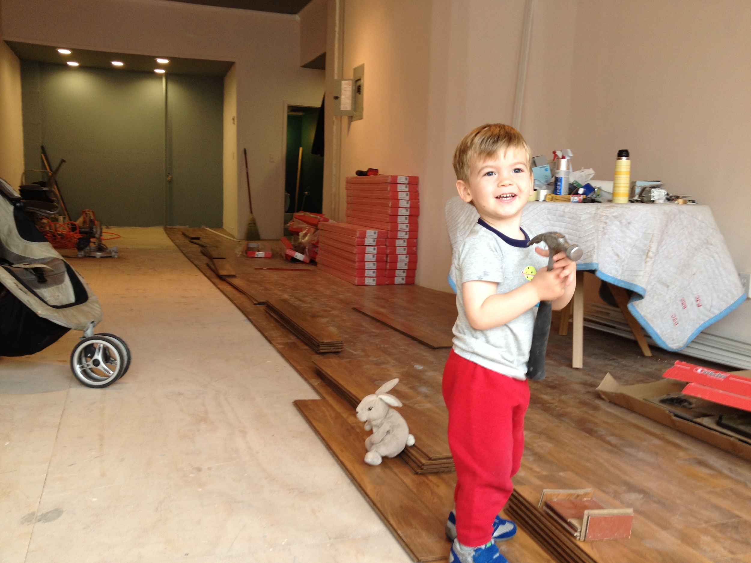 A growing boy (and his bunny) helping to renovate his Mama's first storefront studio in 2013