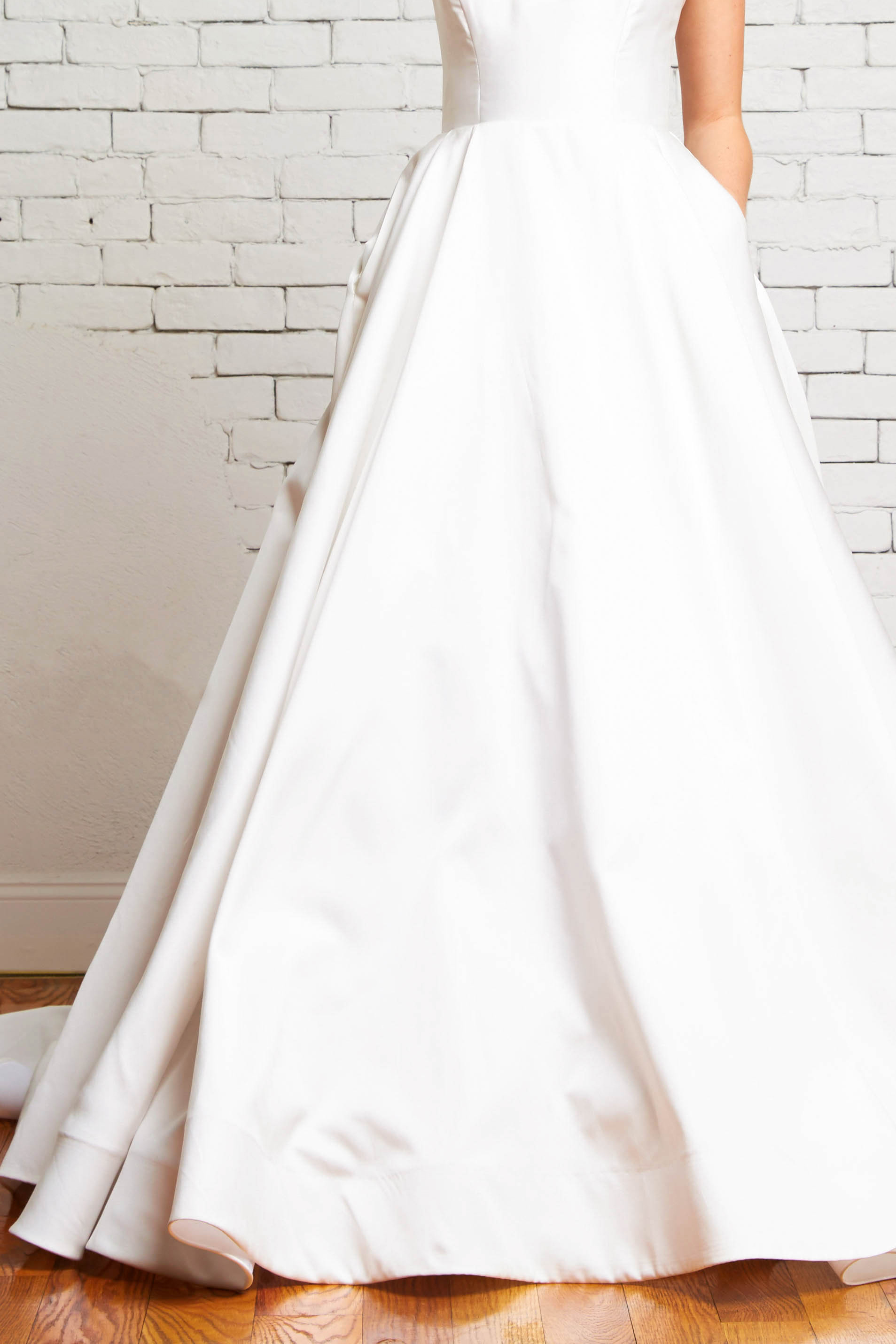 Reese Front-Rebecca Schoneveld_modern_ball_gown_simple_with_pockets_and_buttons.jpg