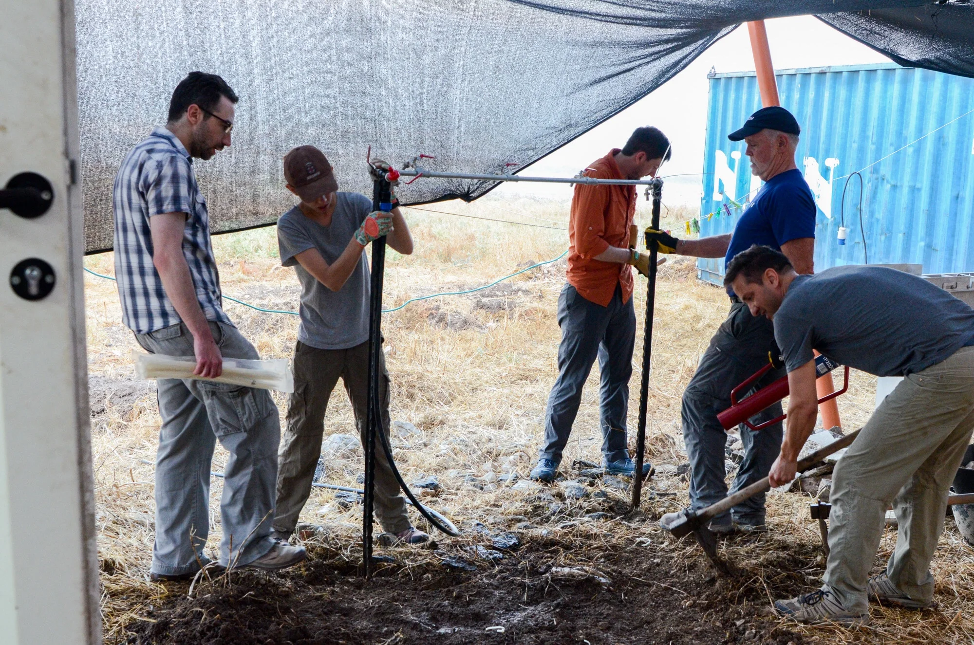 Constructing a pavement for the water spigot in the pottery compound