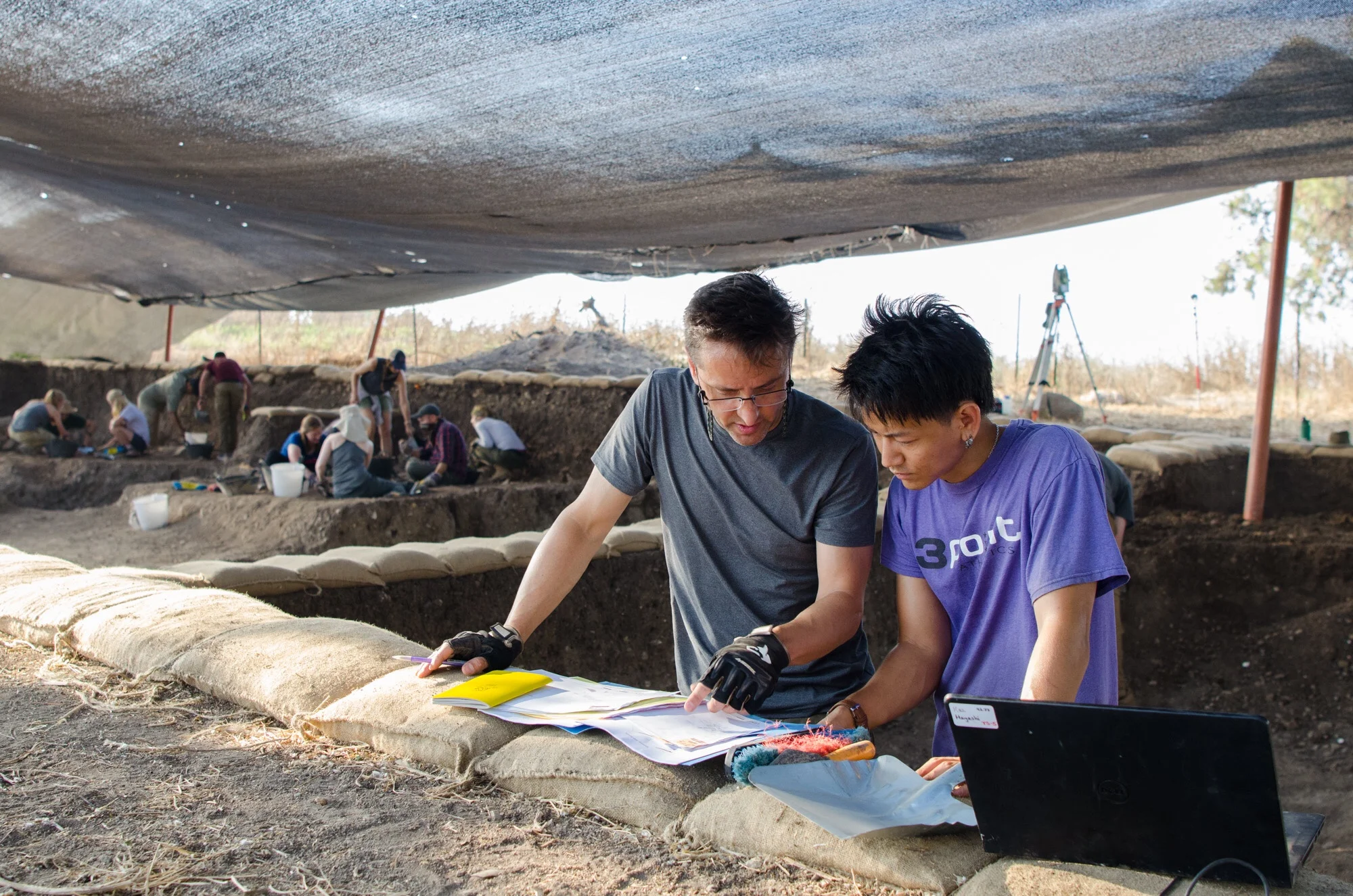 Grid Supervisor Adam Aja discusses a top plan with Square Supervisor Kaz Hayashi in Grid 92