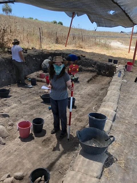 Holding the stadia rod for GIS