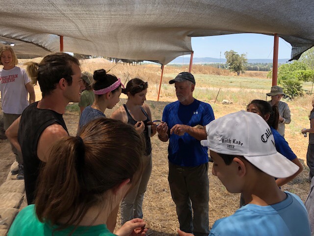 Gordy Tucker leading a flint knapping demonstration
