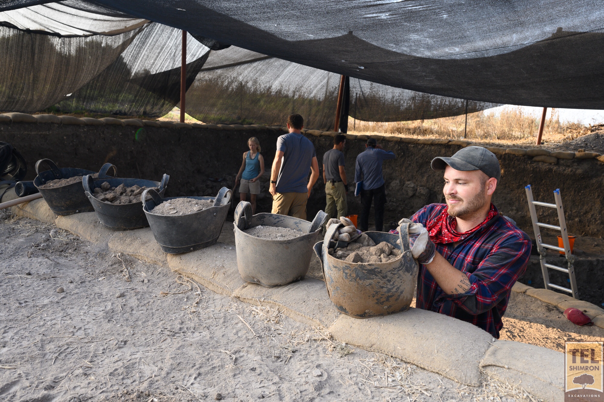 Getting the dirt out of the excavation area in Grid 92