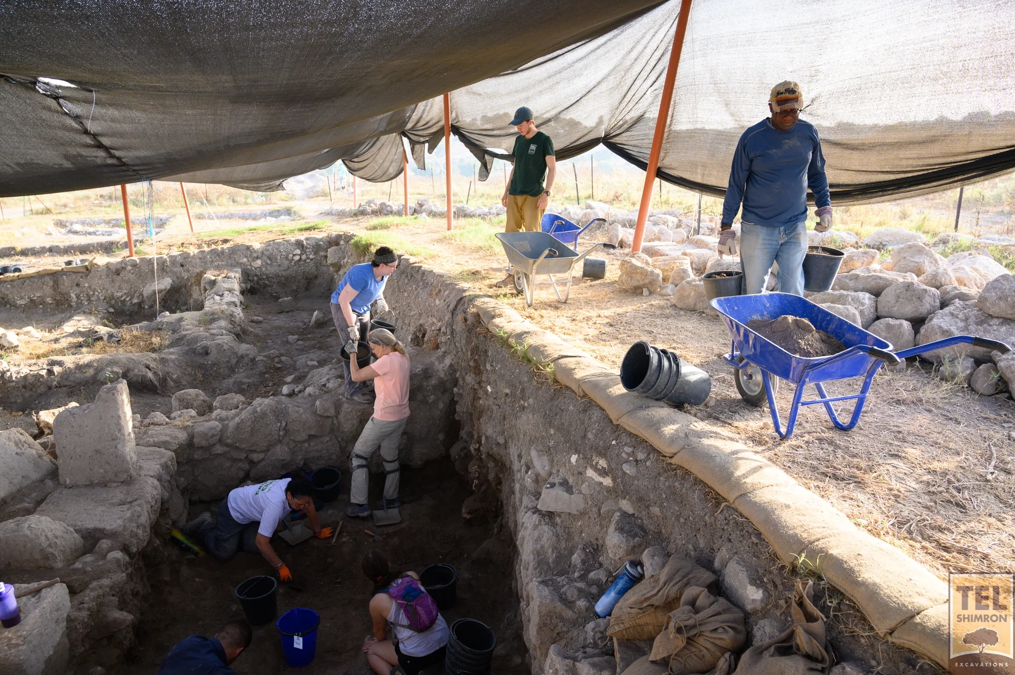 Volunteers in Grid 23/24 trace a stone floor in a Roman period building