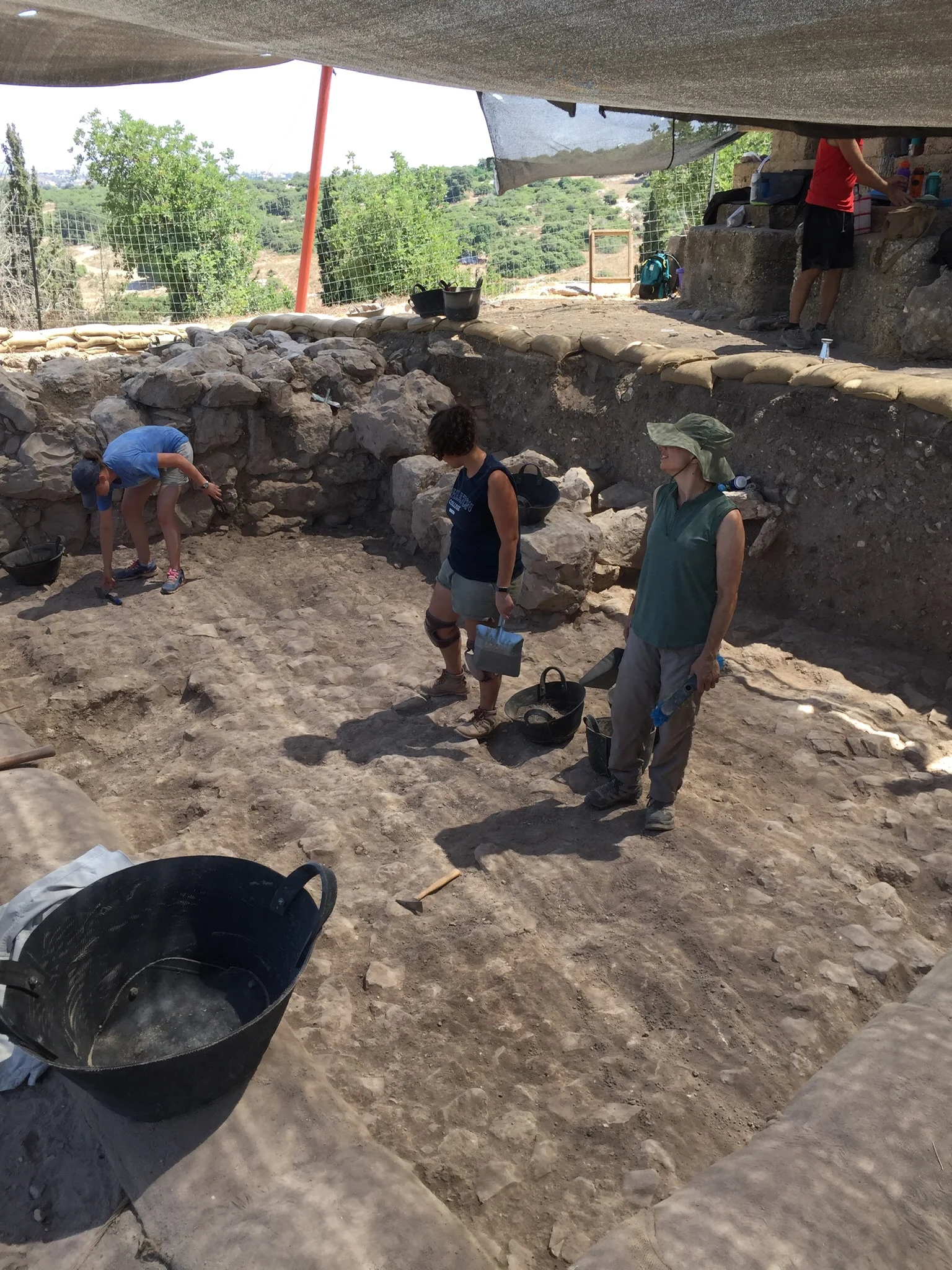 Another area in Grid 33 with well-preserved walls and a stone pavement
