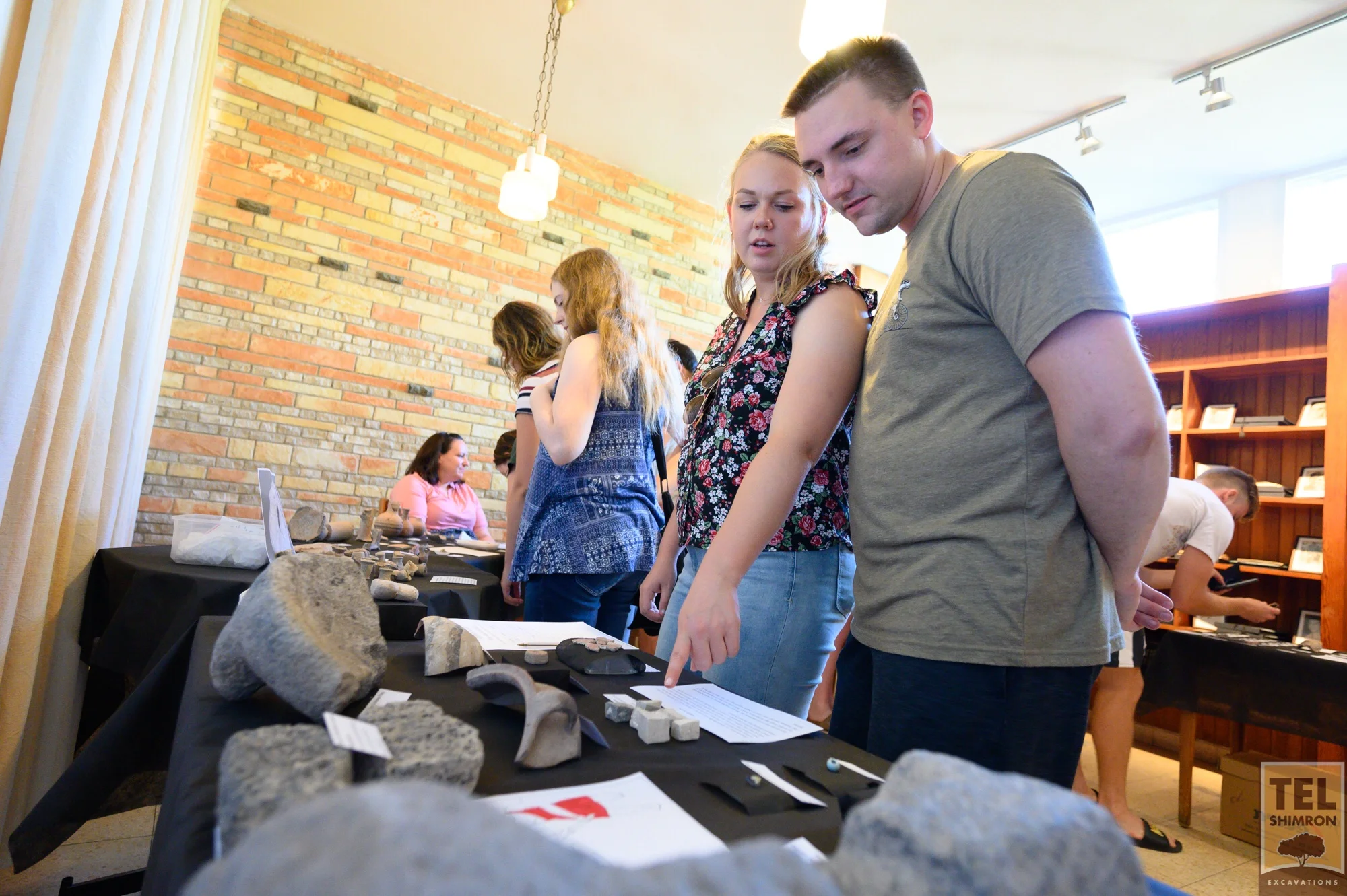 Staff examine artifacts at the Finds Display