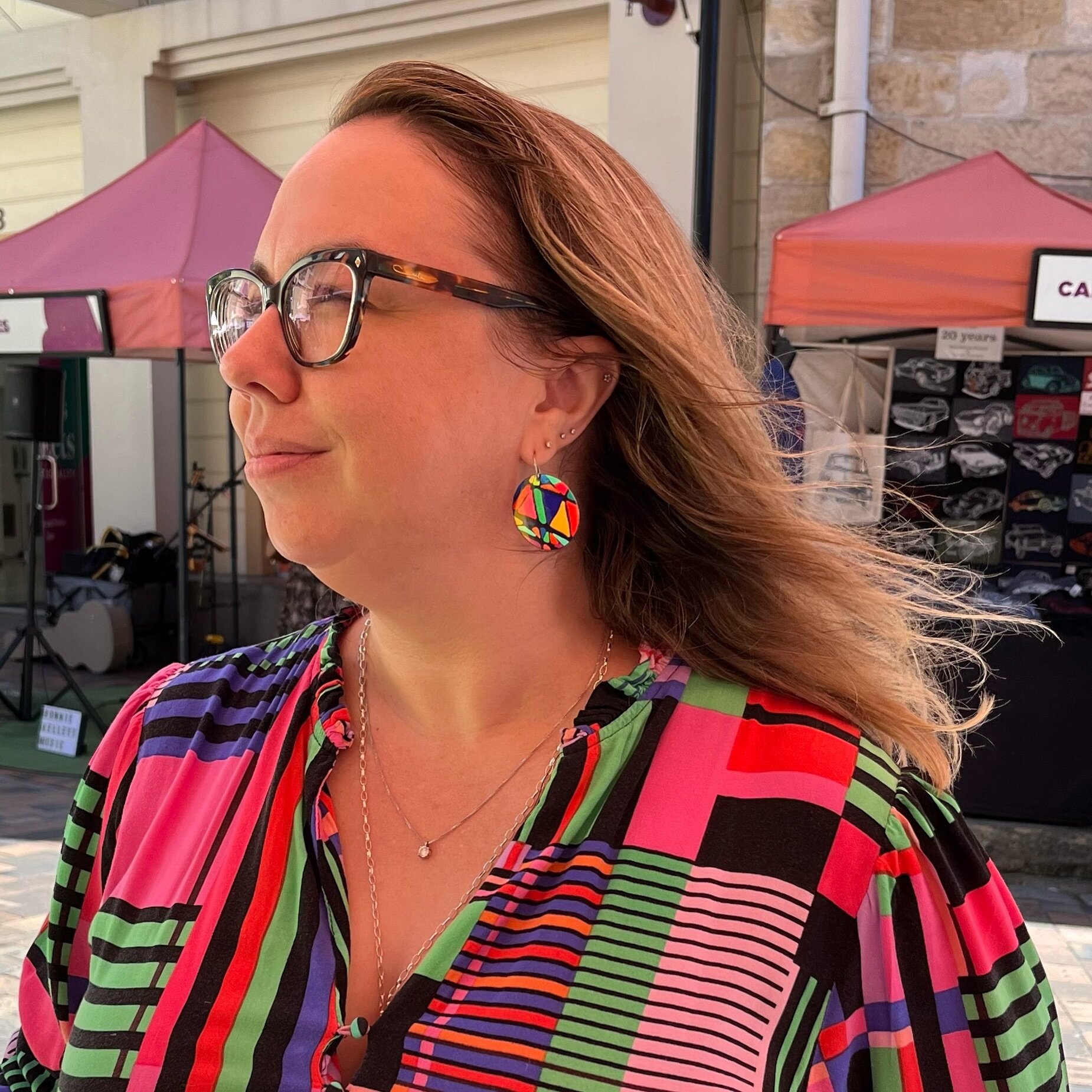 🔸MEANT TO BE: 
How awesome does my new customer look in her Sydney Harbour Bridge earrings? 
🔻We enjoyed our chats with many new colour lovers this weekend @therocks 
🔹Thank you Victoria for the photo. 
#emiliofrankdesign #colourlovers #jewelleryd