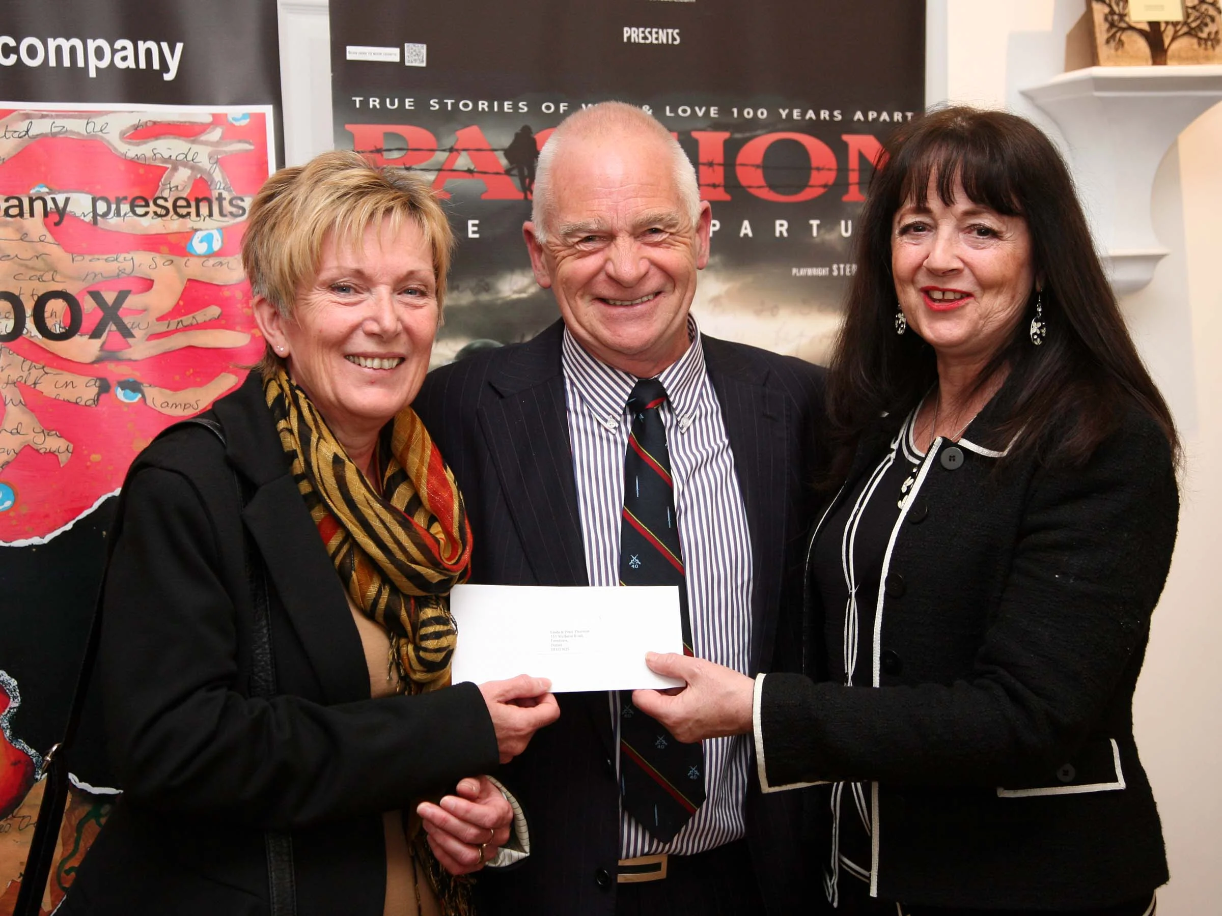 Linda & Peter accept cheque from AsOne
