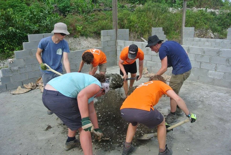 Mixing cement for the kindergarten foundations