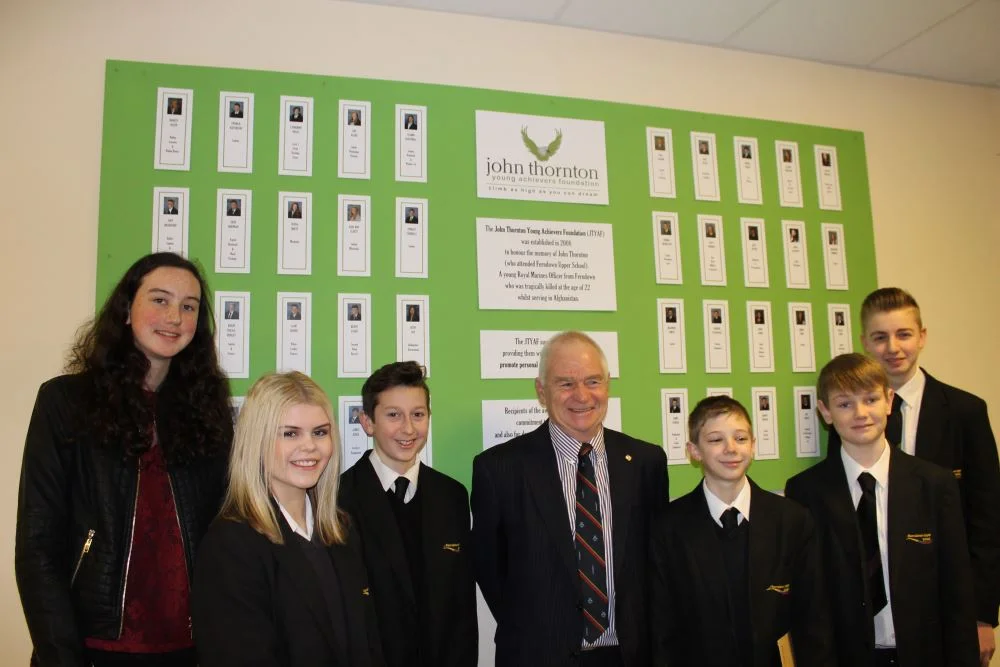 FUS-award-board-with-students.jpg