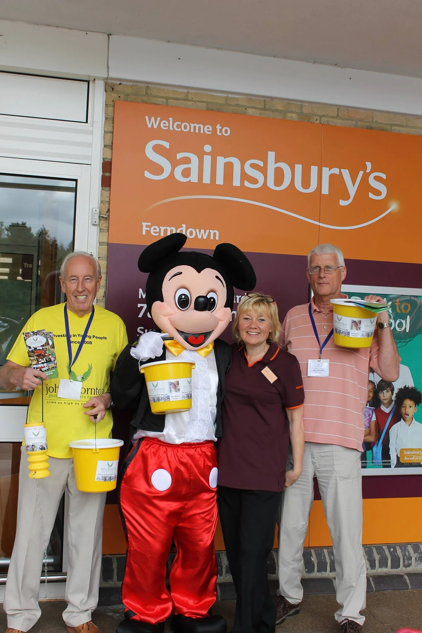 trustee Maurice Pattersonwith mickey, a sainsbury's volunteer and John Nicholson in the peach top