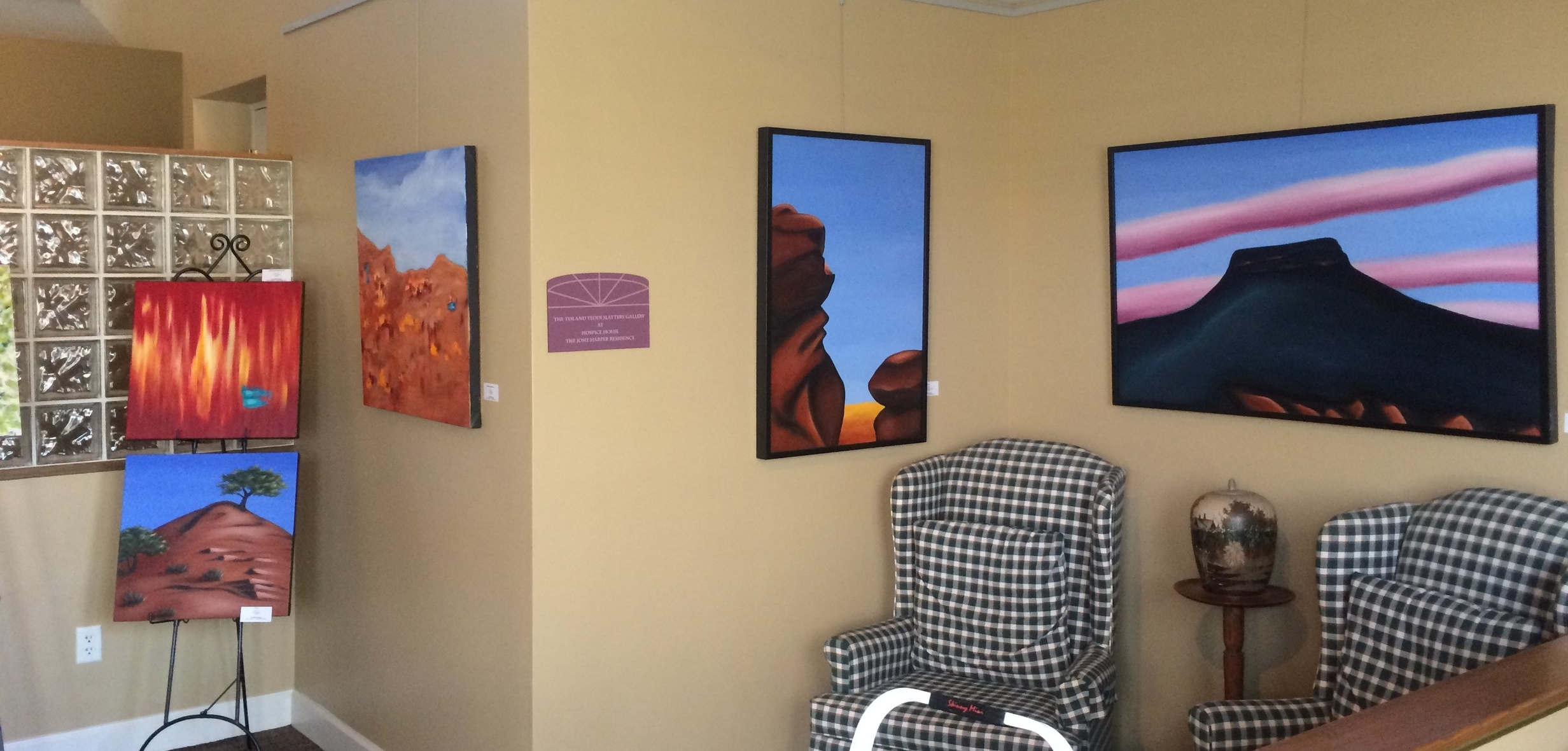 Some of my Southwest-inspired oil paintings on display in the lounge area