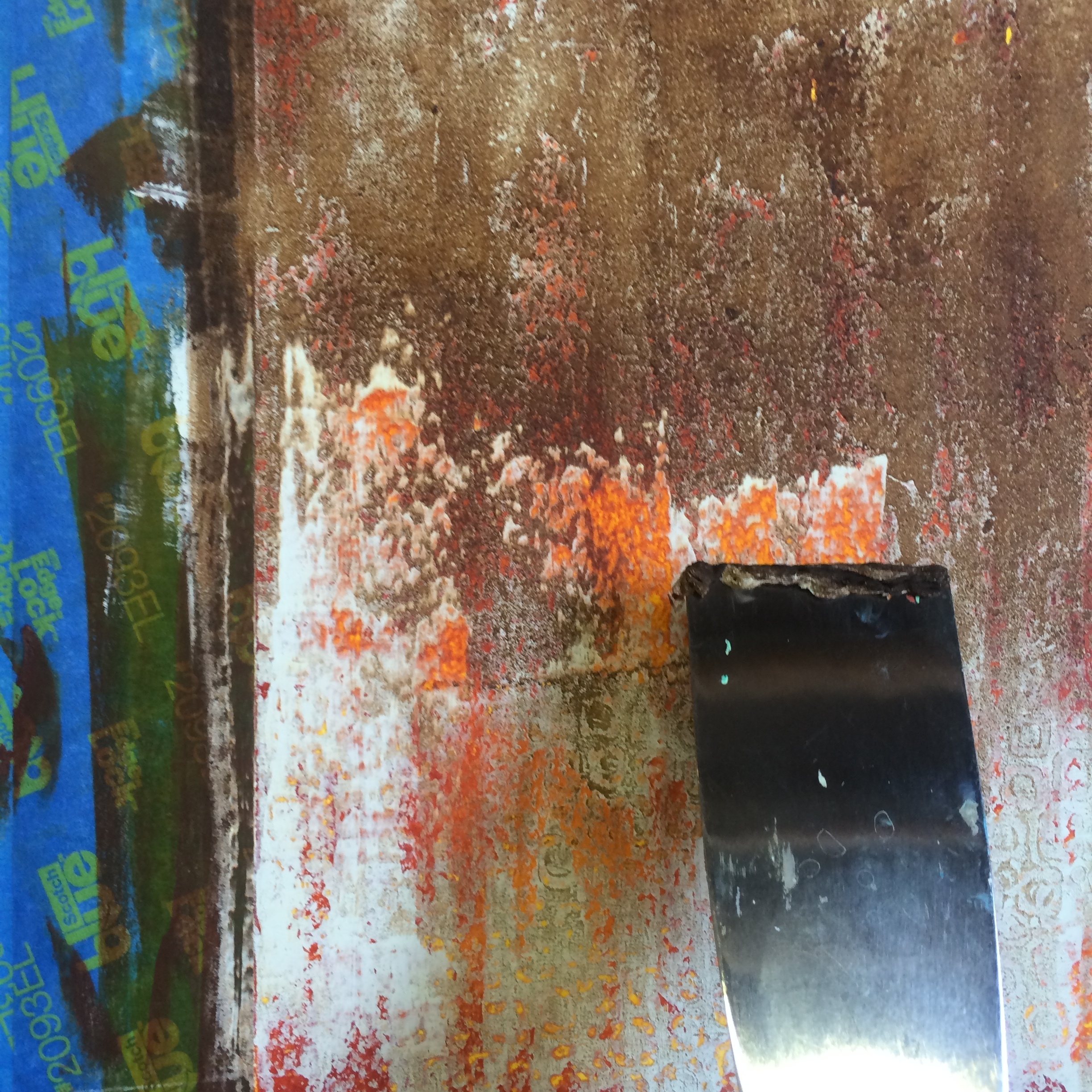 scraping with a utility knife to reveal underlying colors 