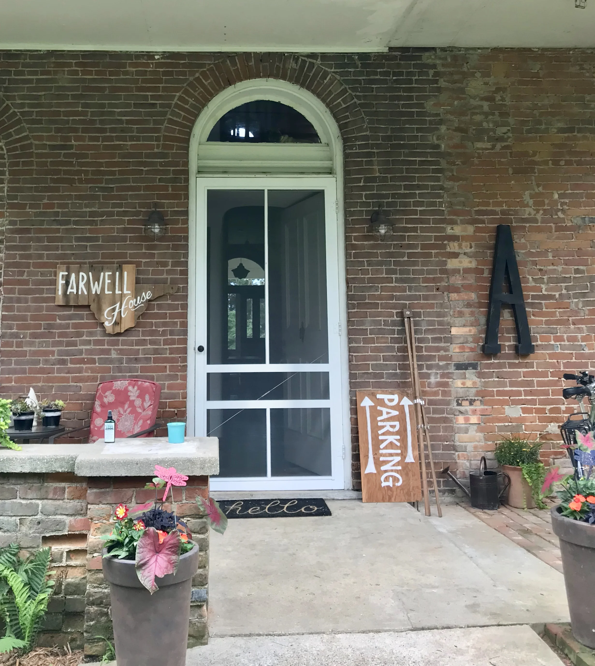 The welcoming entry of Farwell House sports a sign cut in the shape of Schuyler County. 
